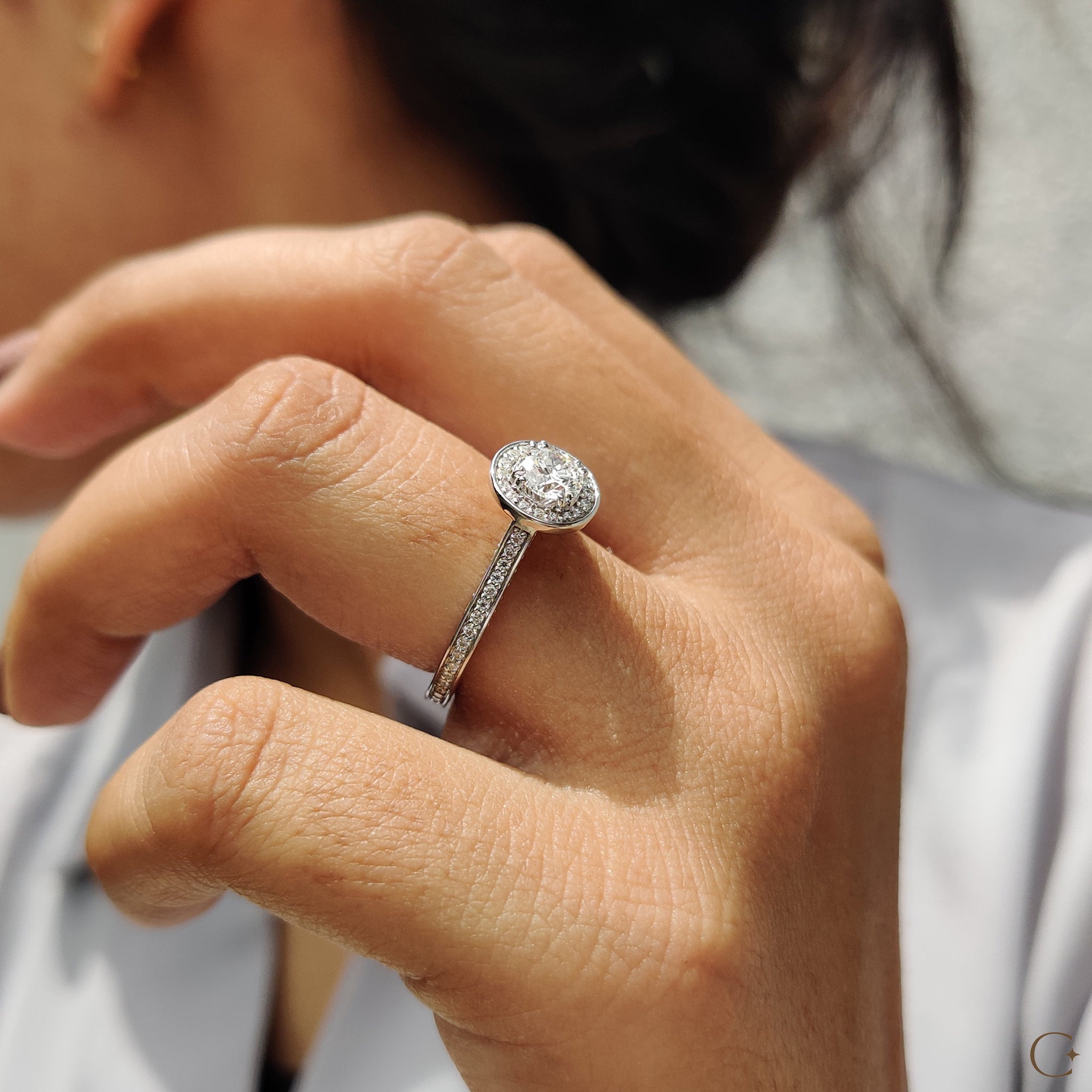 Double prong ring setting for enhanced diamond brilliance.
