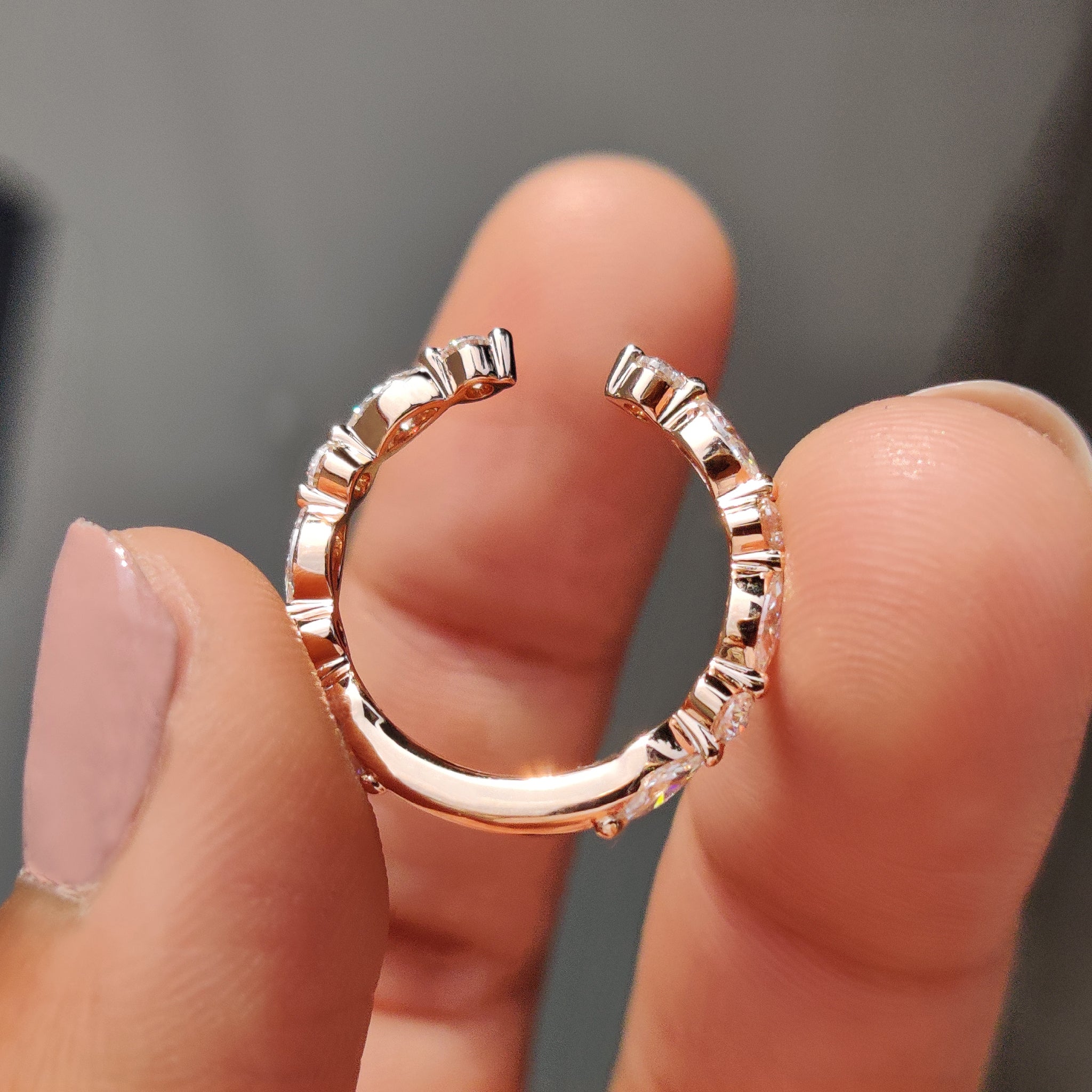 Rose gold wedding band in a round and marquise wedding band style.