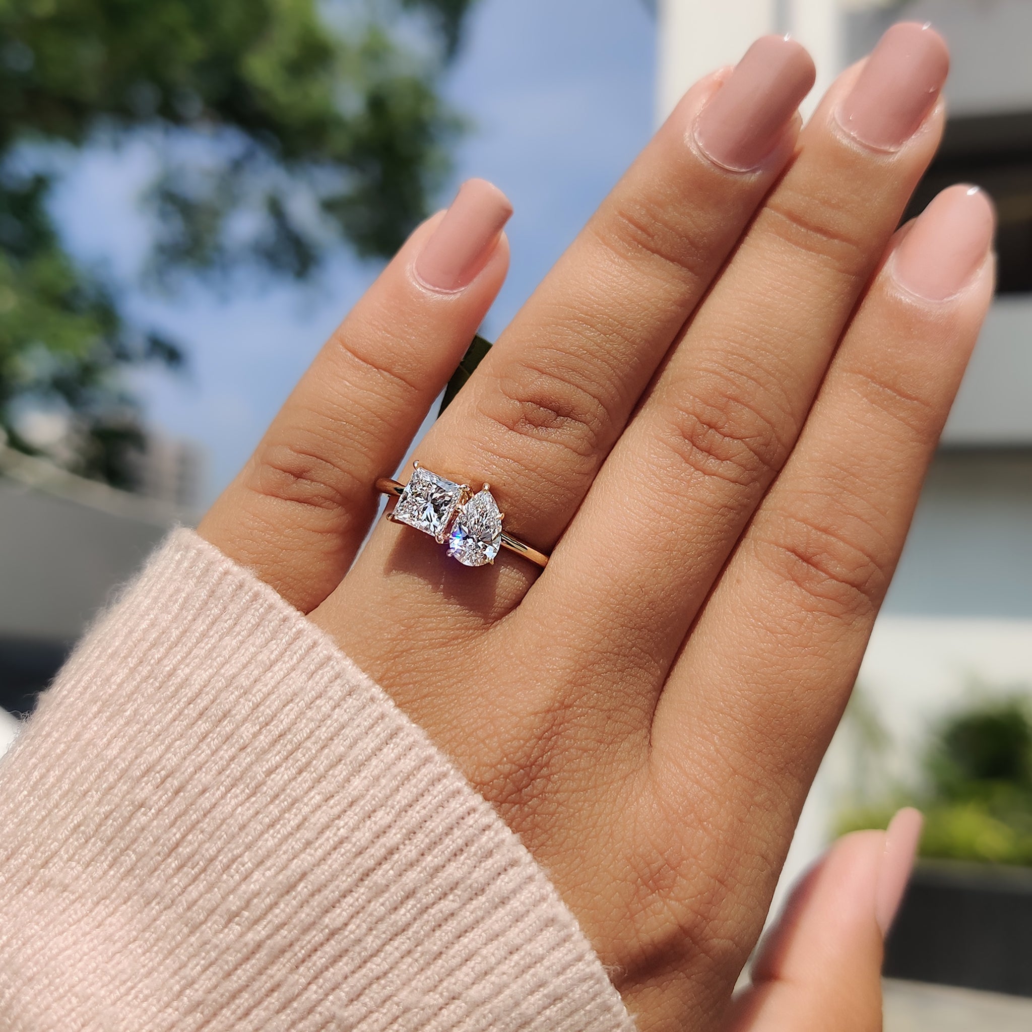 A beautiful carat diamonds ring designed as a toi et moi style, combining a lab-grown princess cut diamond and a pear cut diamond.
