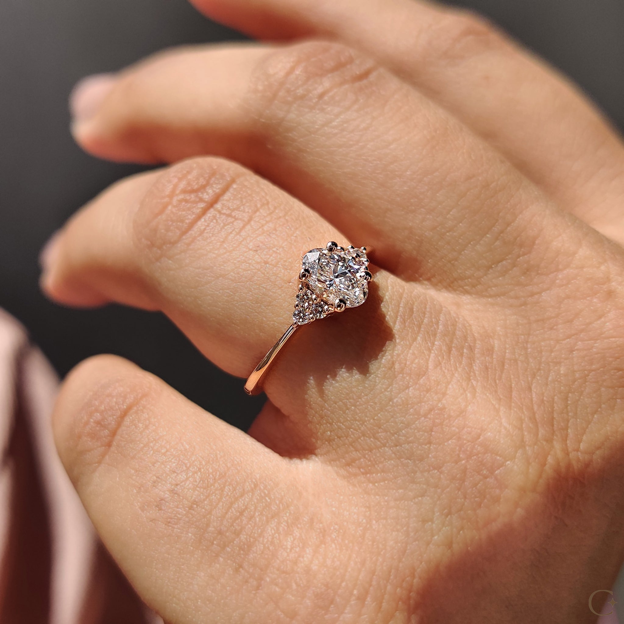 Carat Diamonds engagement ring with oval shaped center stone.
