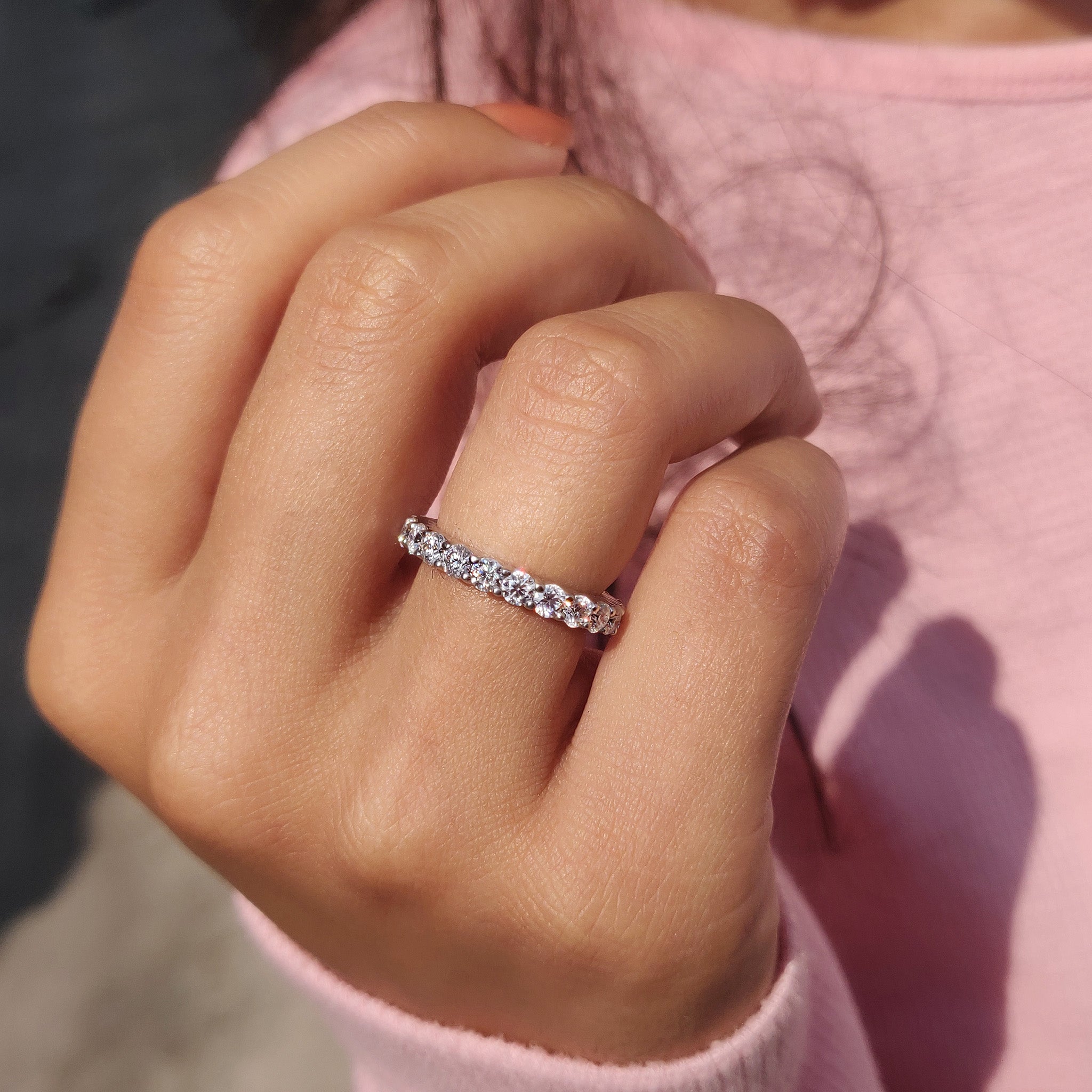 Moissanite wedding band completes handmade band.
