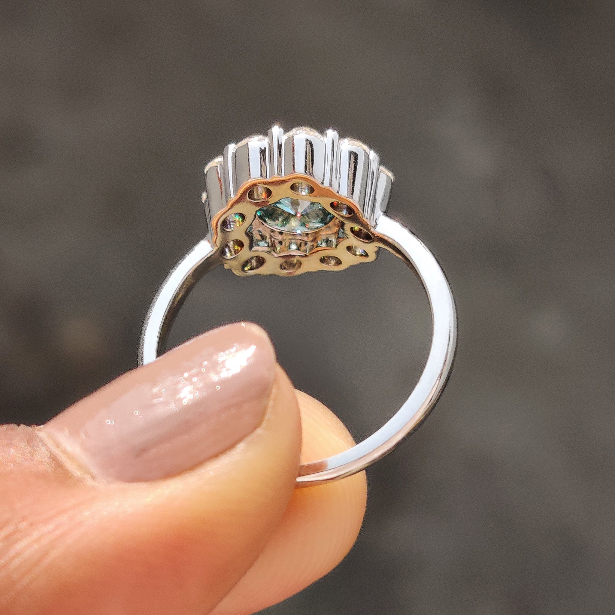 Cluster halo ring wraps beauty around your center stone.