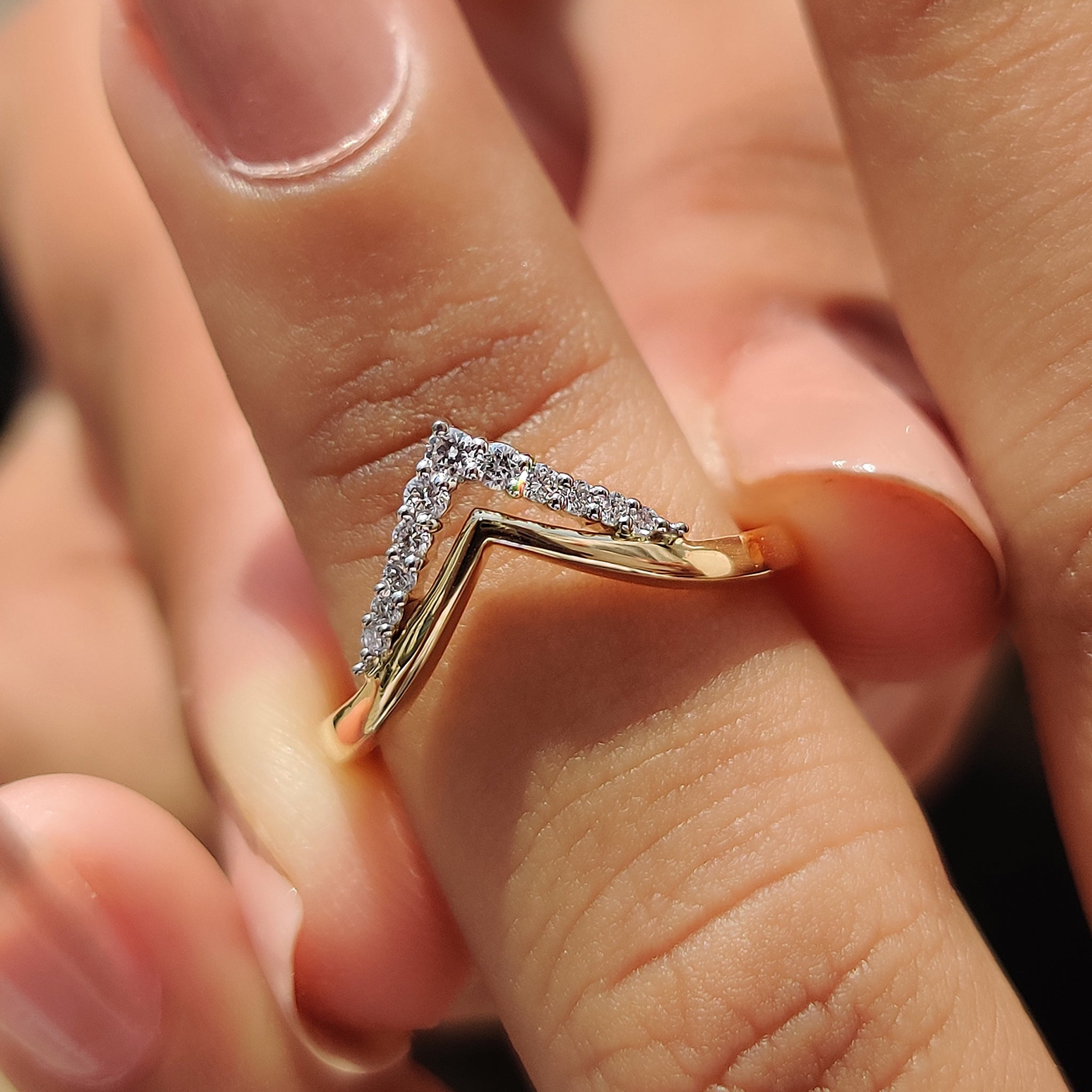 Double chevron wedding band in white and yellow gold.
