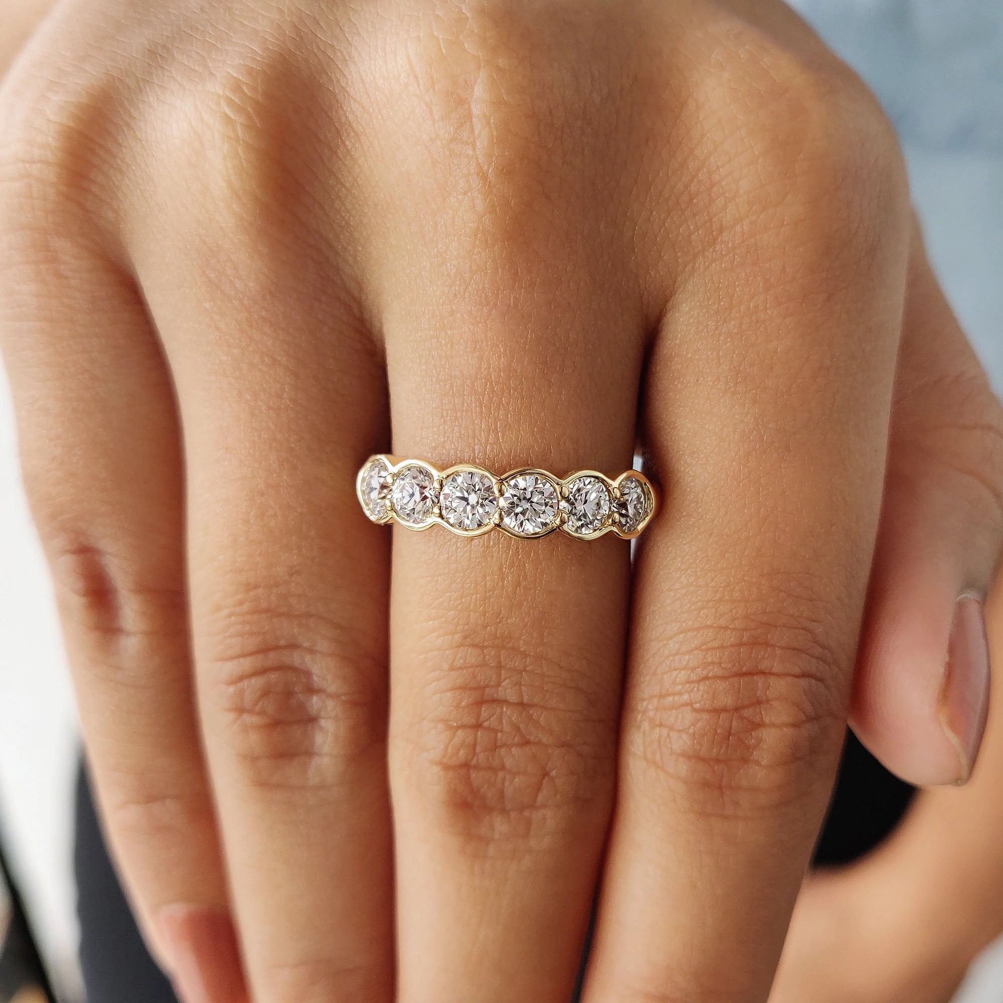 Moissanite wedding band with 6 round stones and handmade craftsmanship.
