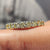 Handmade jewelry featuring round moissanite and bright color.