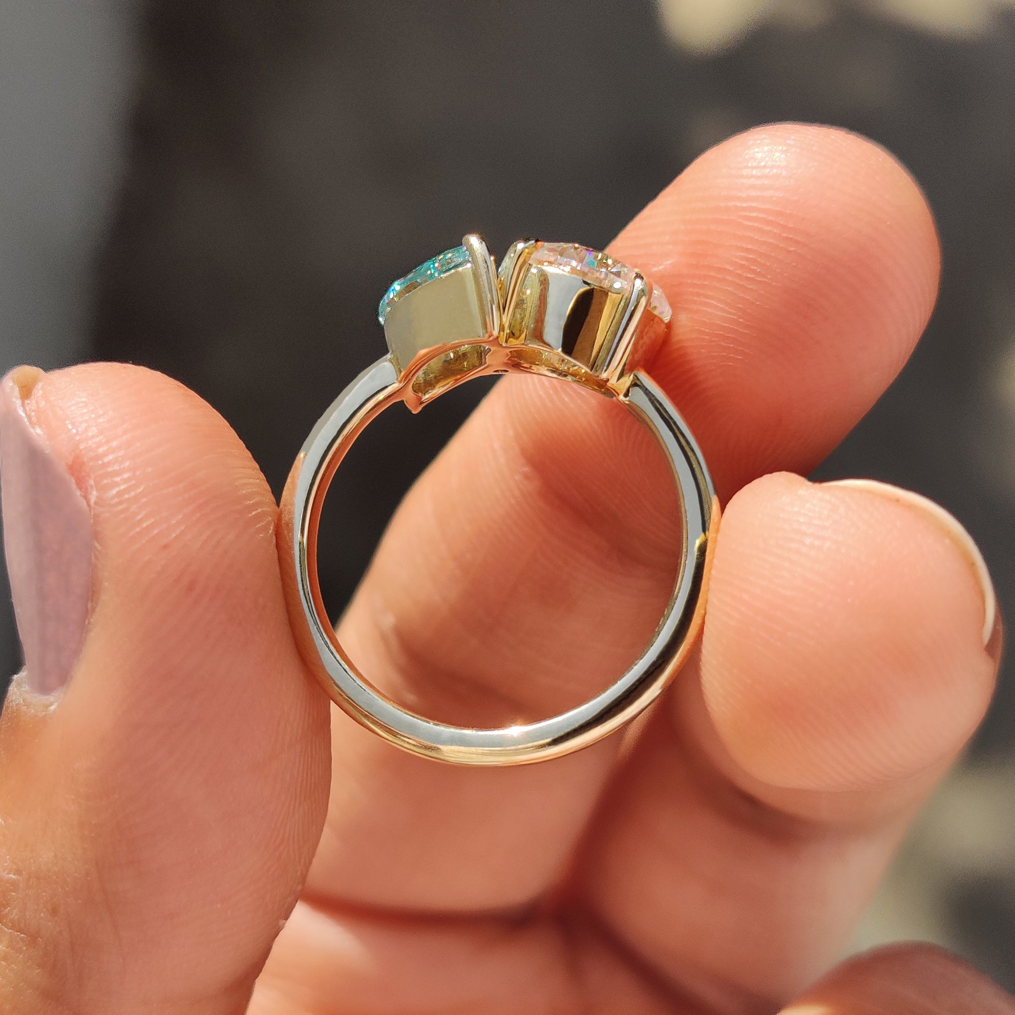 Round moissanite ring beams with soft lovely brilliance.
