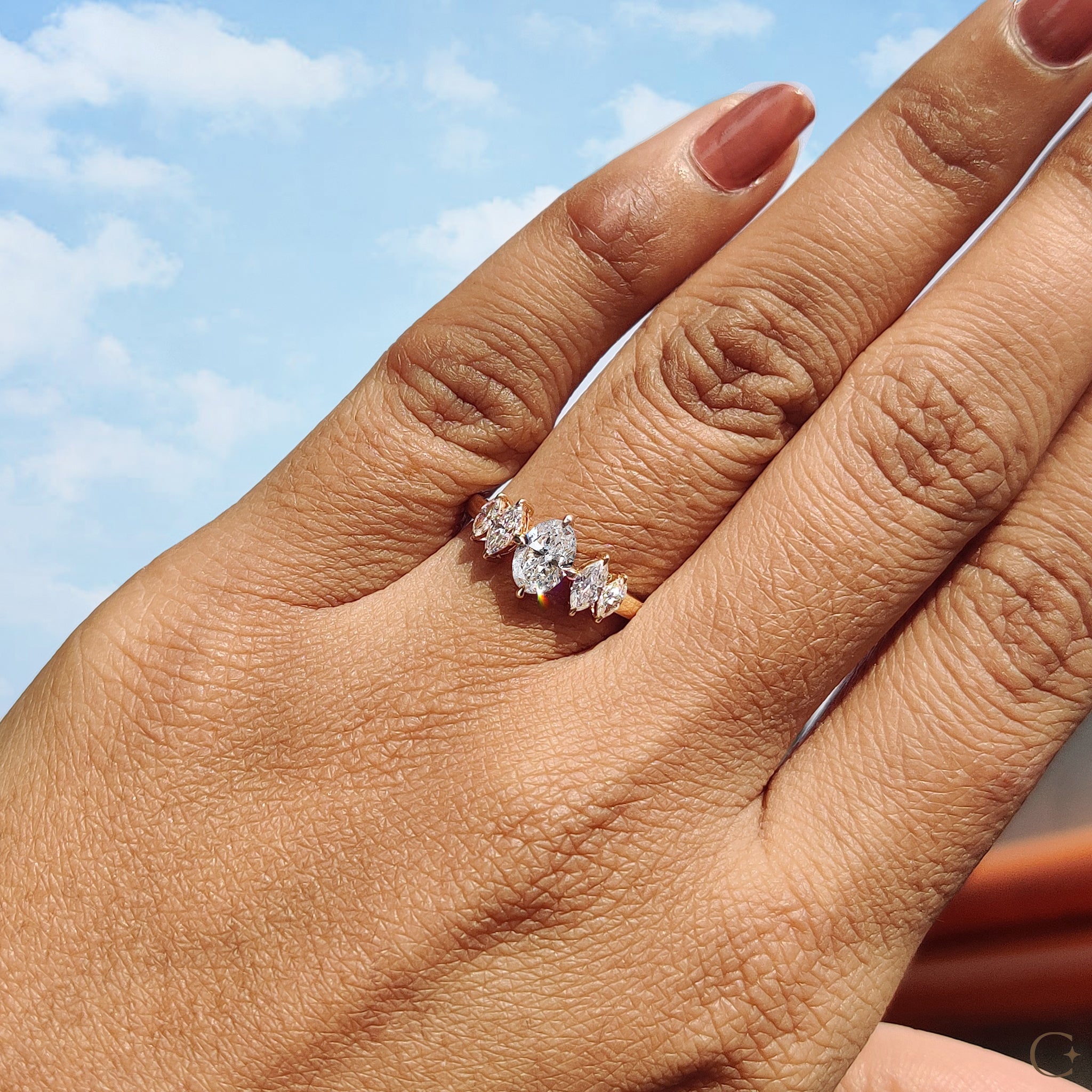 Oval and marquise diamond ring with a unique design
