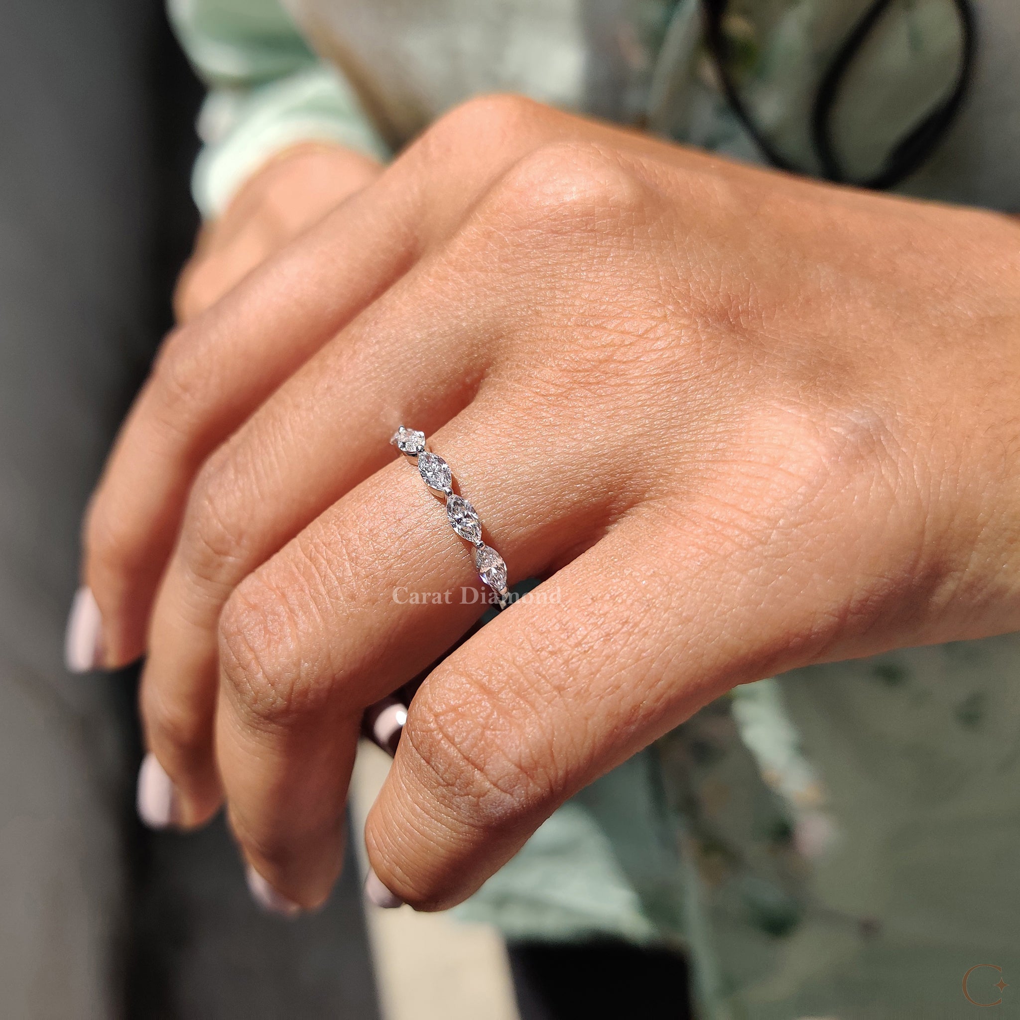 Shared prong wedding band showcasing two round-cut diamonds.
