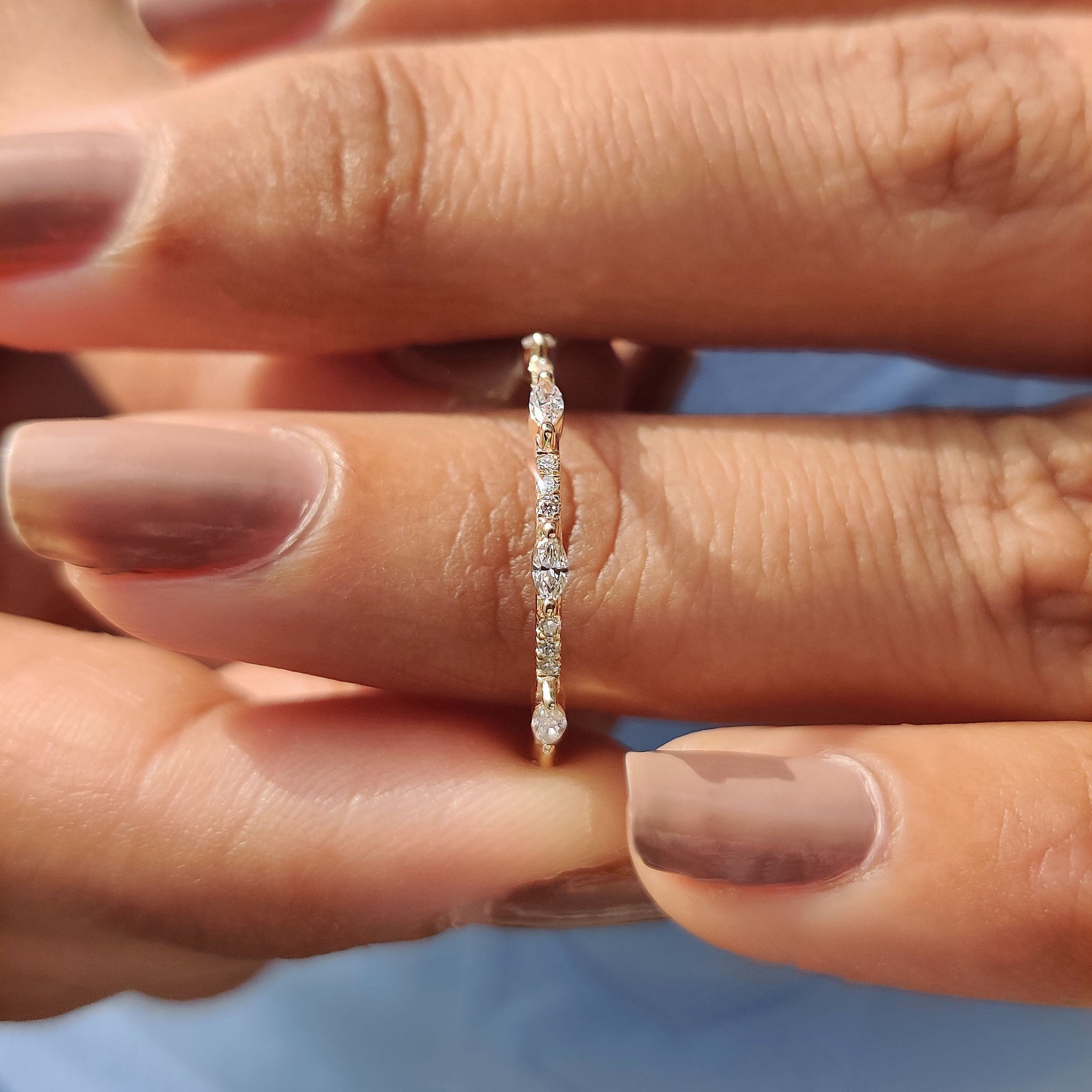 Prong set wedding band showcasing brilliant diamonds.
