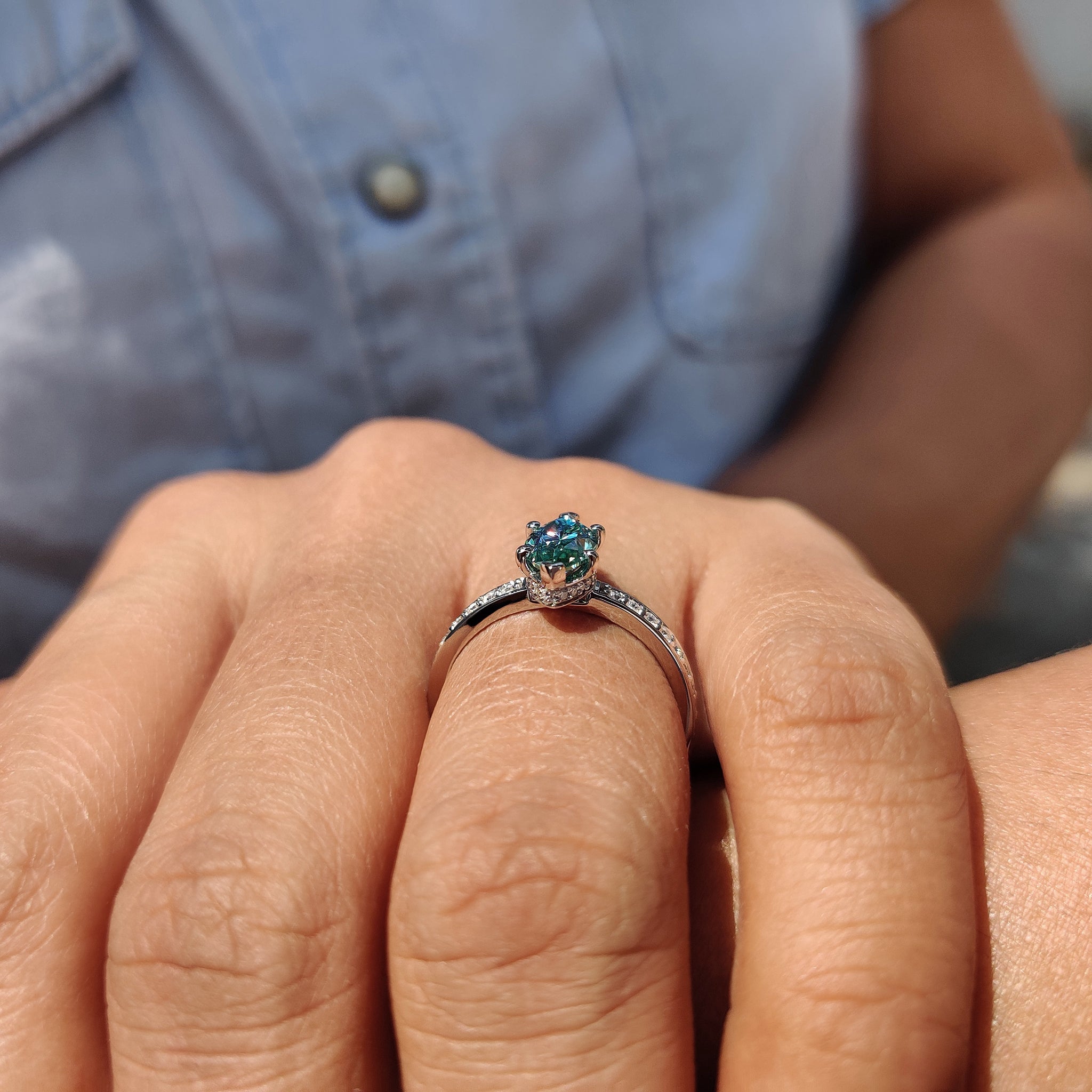 Moissanite engagement ring with a hidden halo setting for a refined and delicate look.
