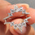 Pear cut wedding band designed as a ring enhancer to wrap around solitaire rings.
