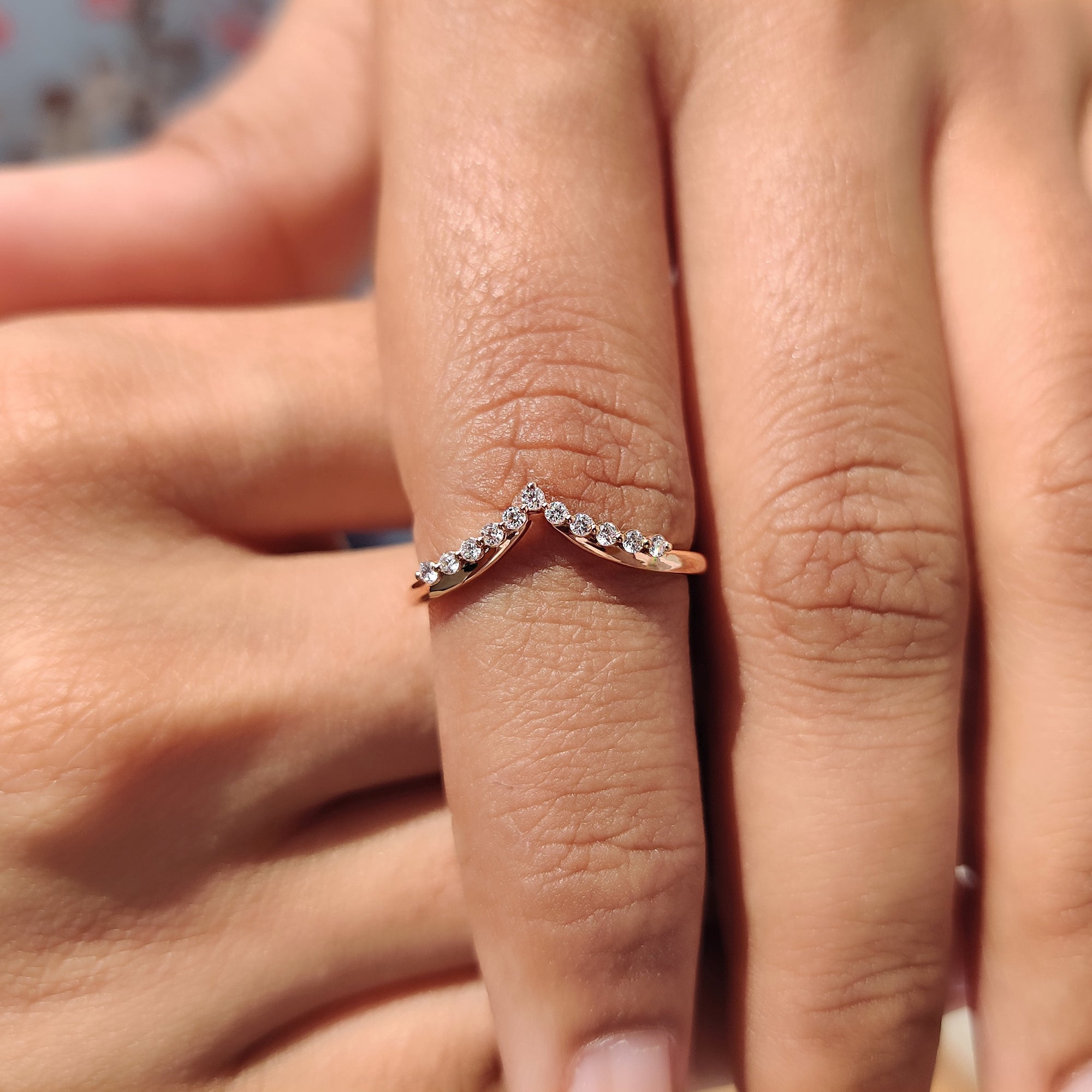 Custom wedding band in a chevron layout with handmade moissanite detailing.