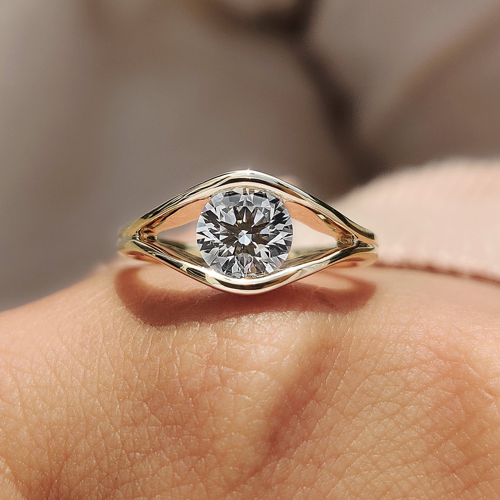 A round cut ring set in yellow gold
