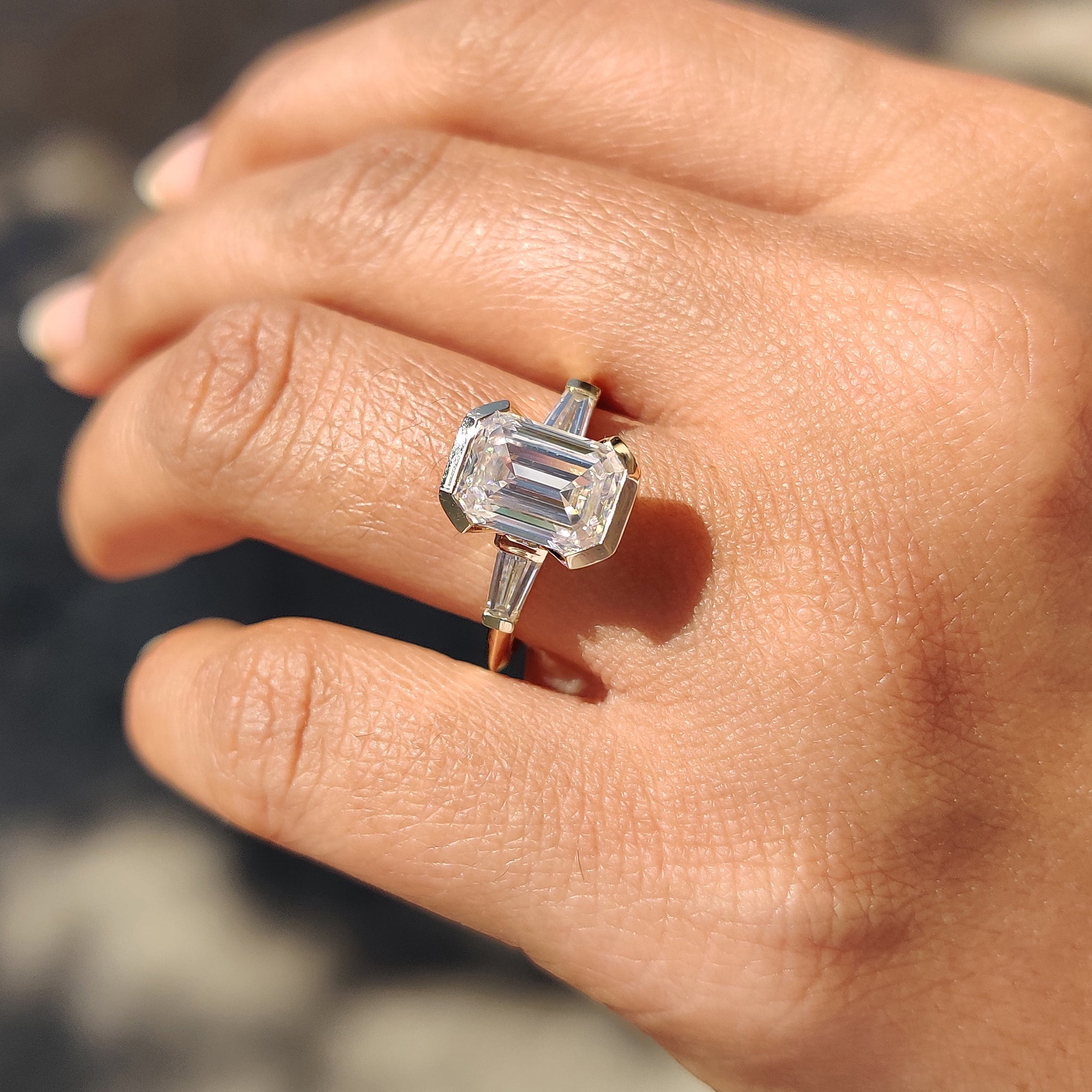 Knife edge shank band with emerald cut Moissanite