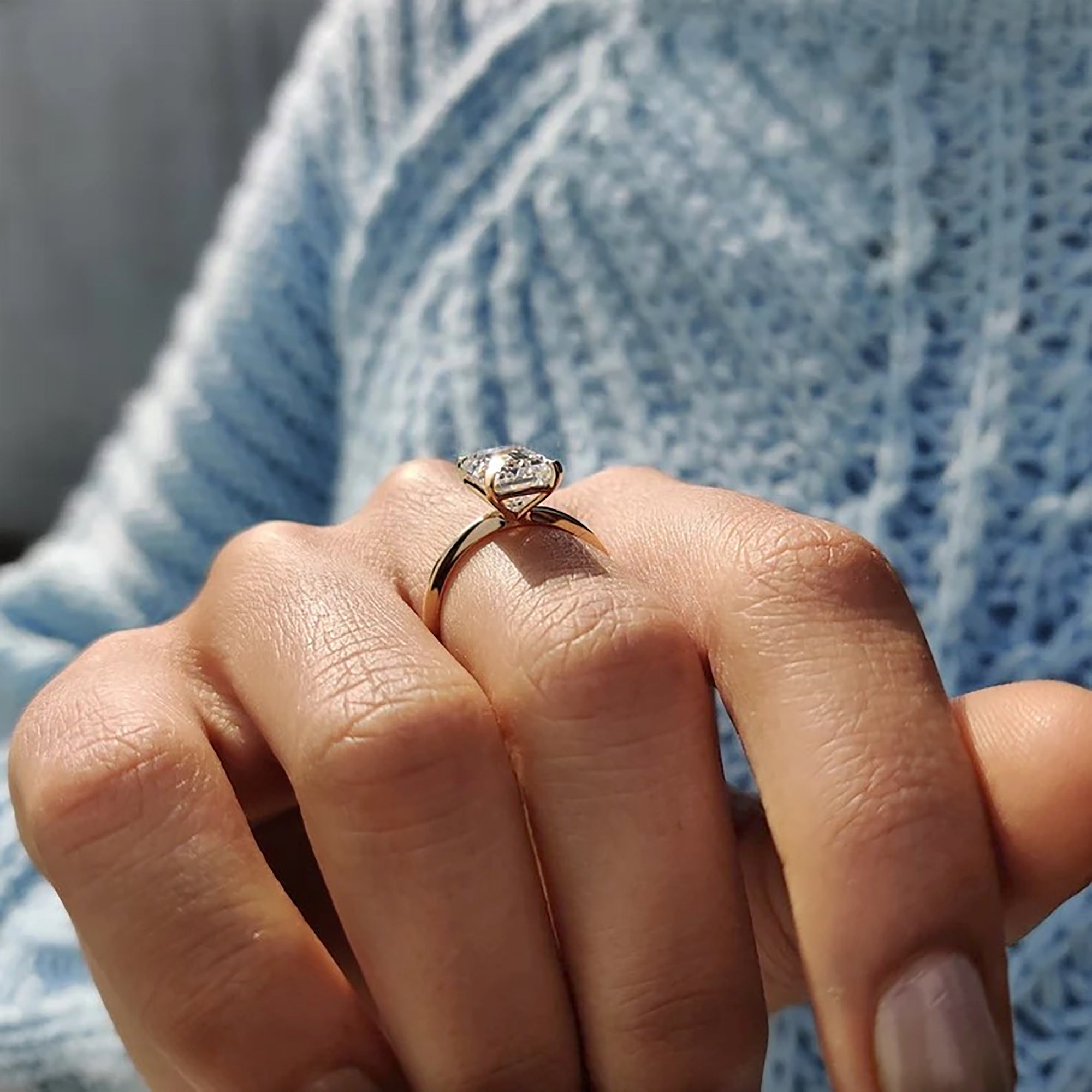 Yellow gold ring with emerald cut solitaire.
