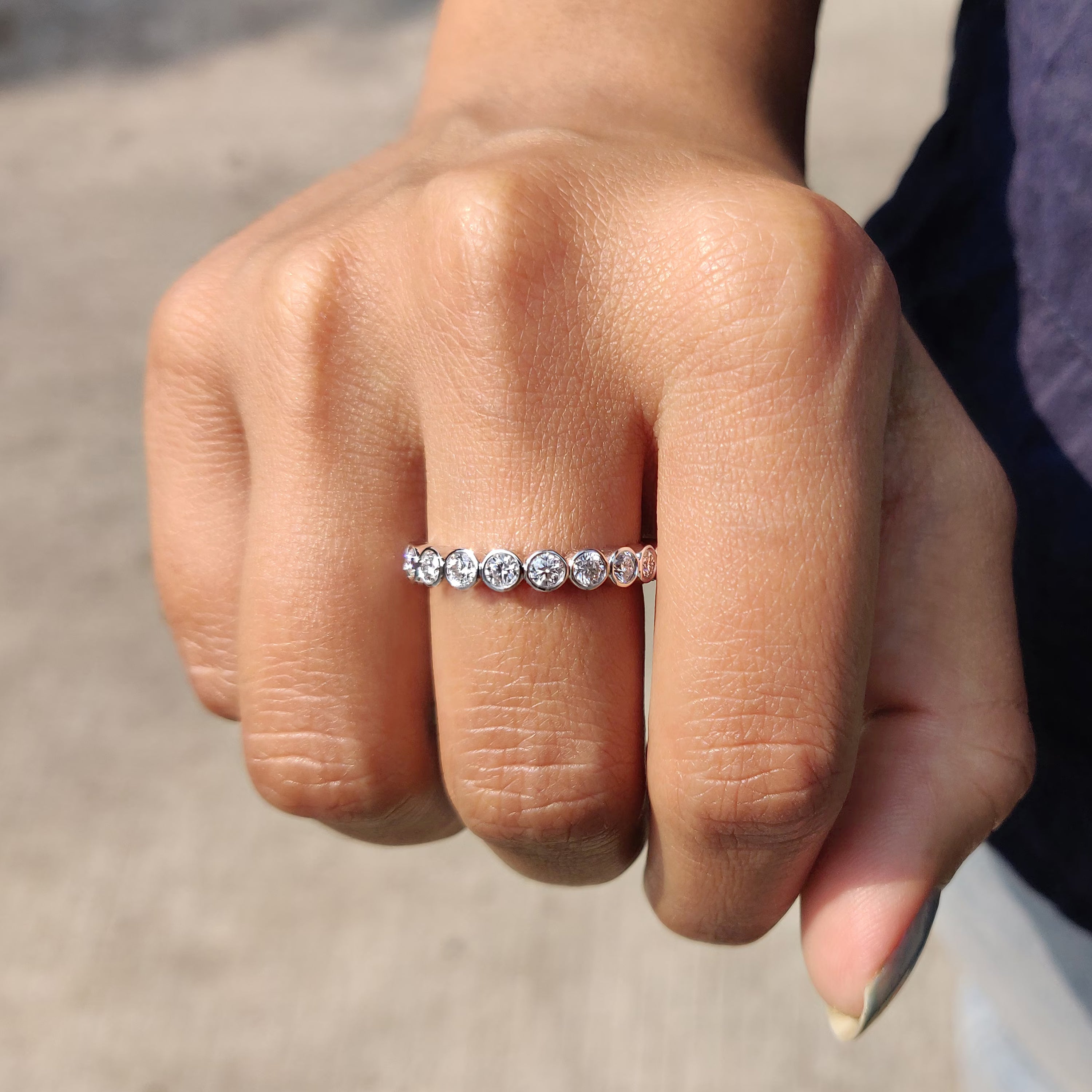 Handmade band with round moissanite stones.
