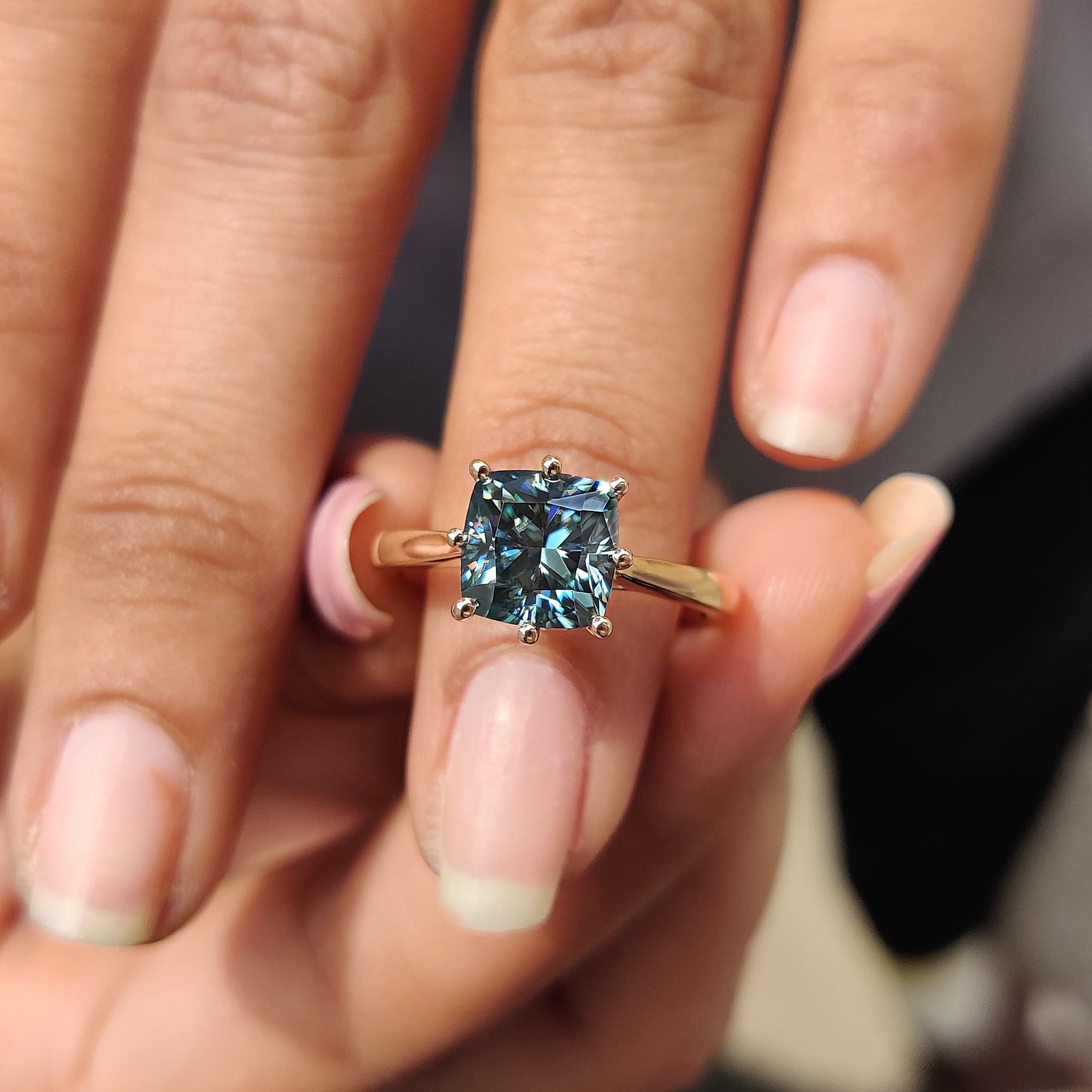 Yellow gold engagement ring holds warmth with bold brightness.