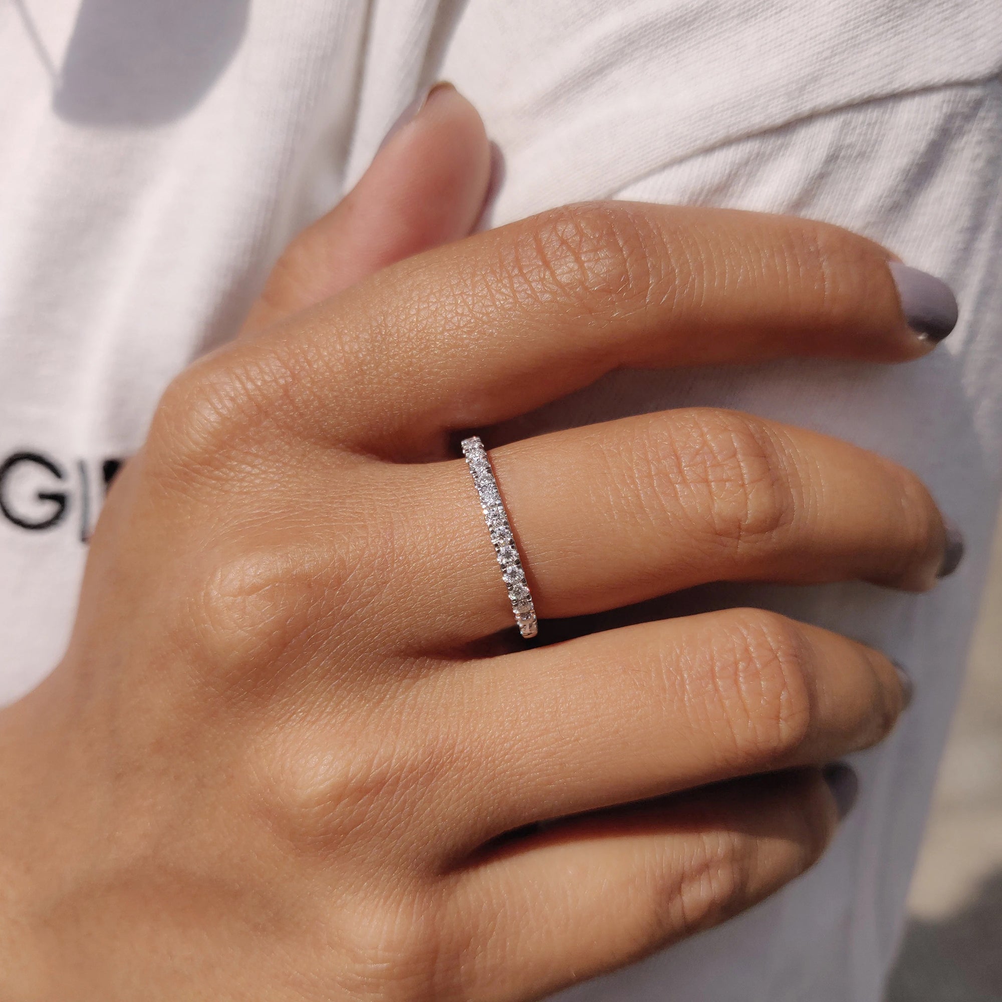 White gold moissanite wedding band fits handmade band.
