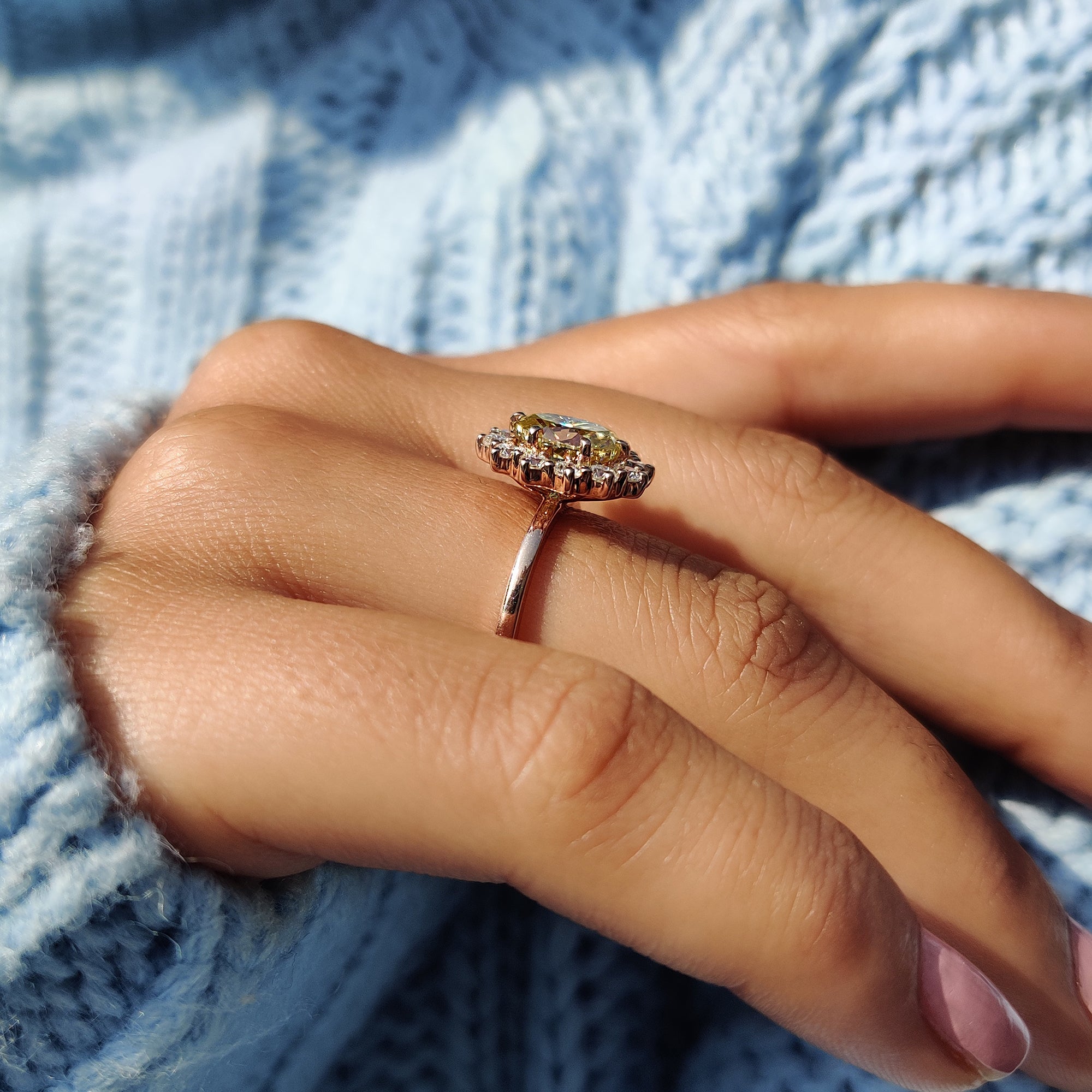 Halo ring adding extra radiance and allure to the central stone.
