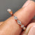 Marquise and round wedding band featuring a round cut band design.