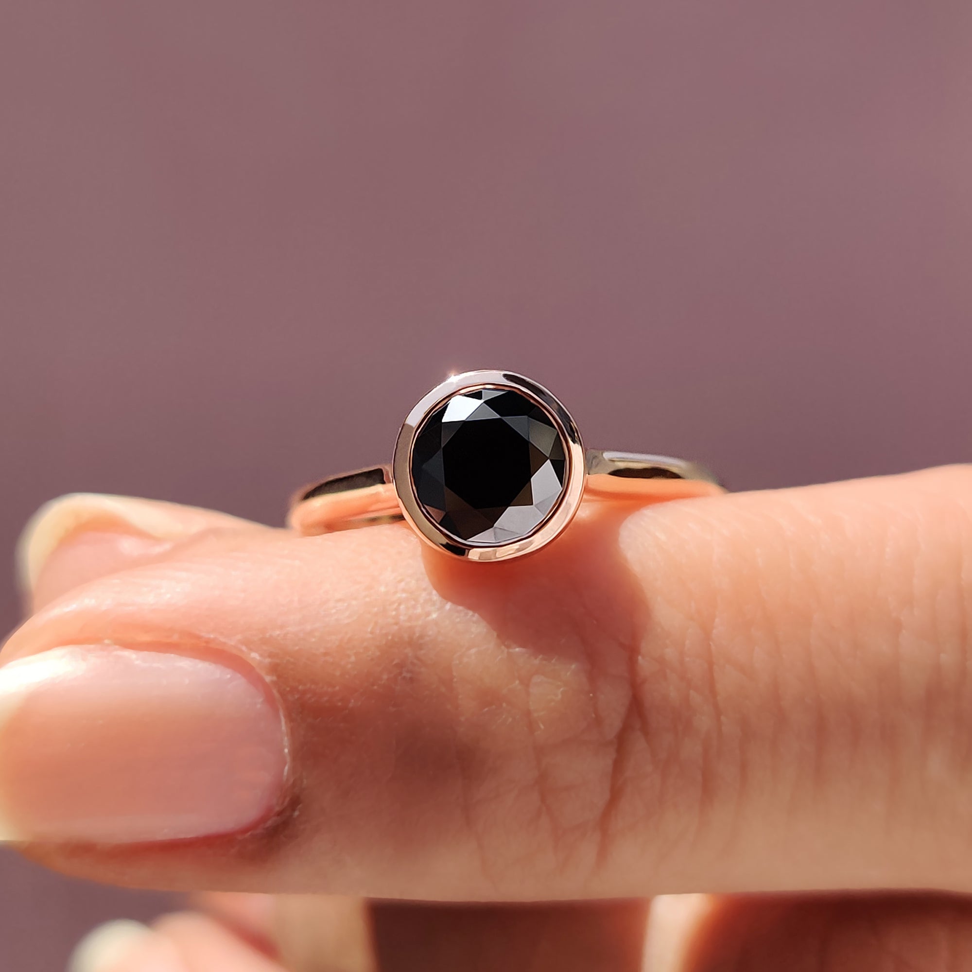 Cathedral engagement ring with black Moissanite and handcrafted rose gold details.
