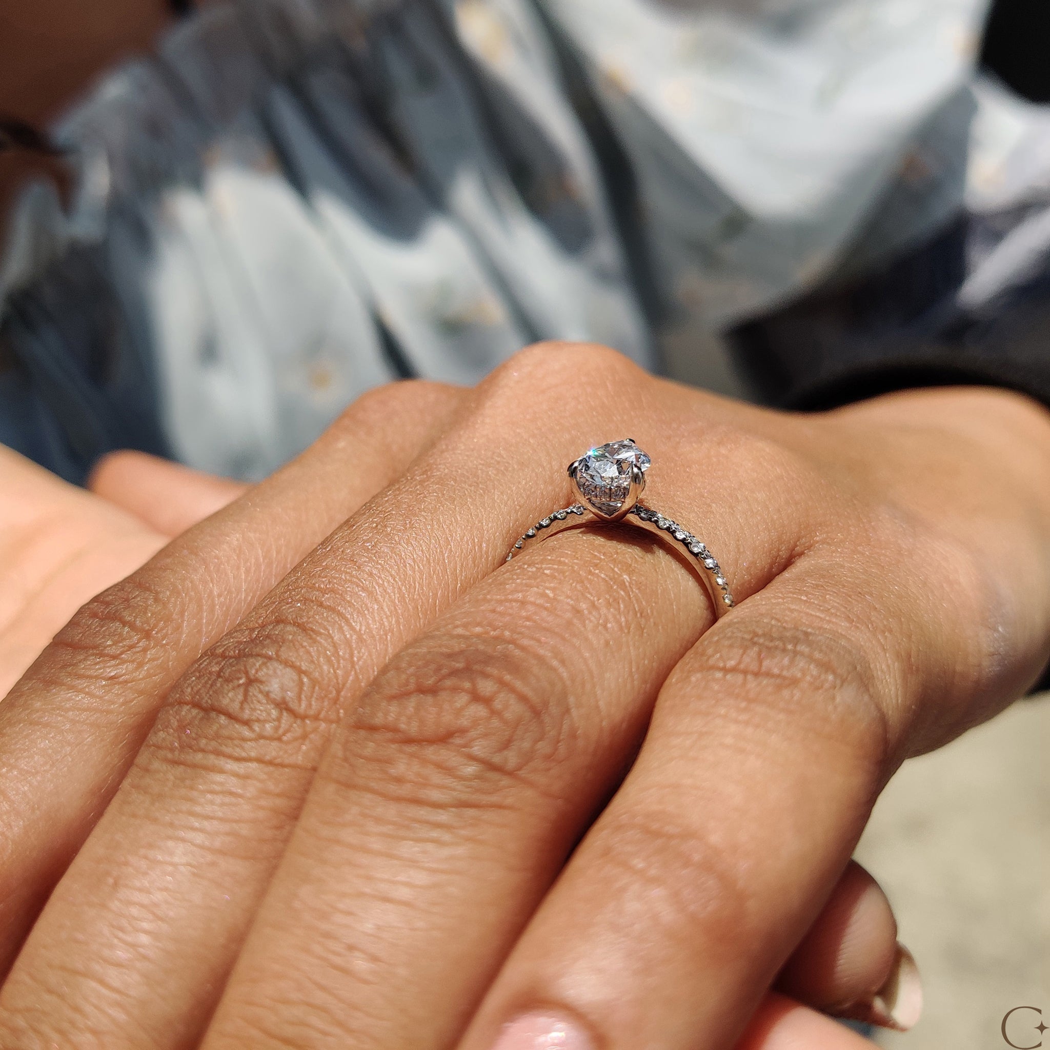 White gold diamond ring featuring intricate detailing.
