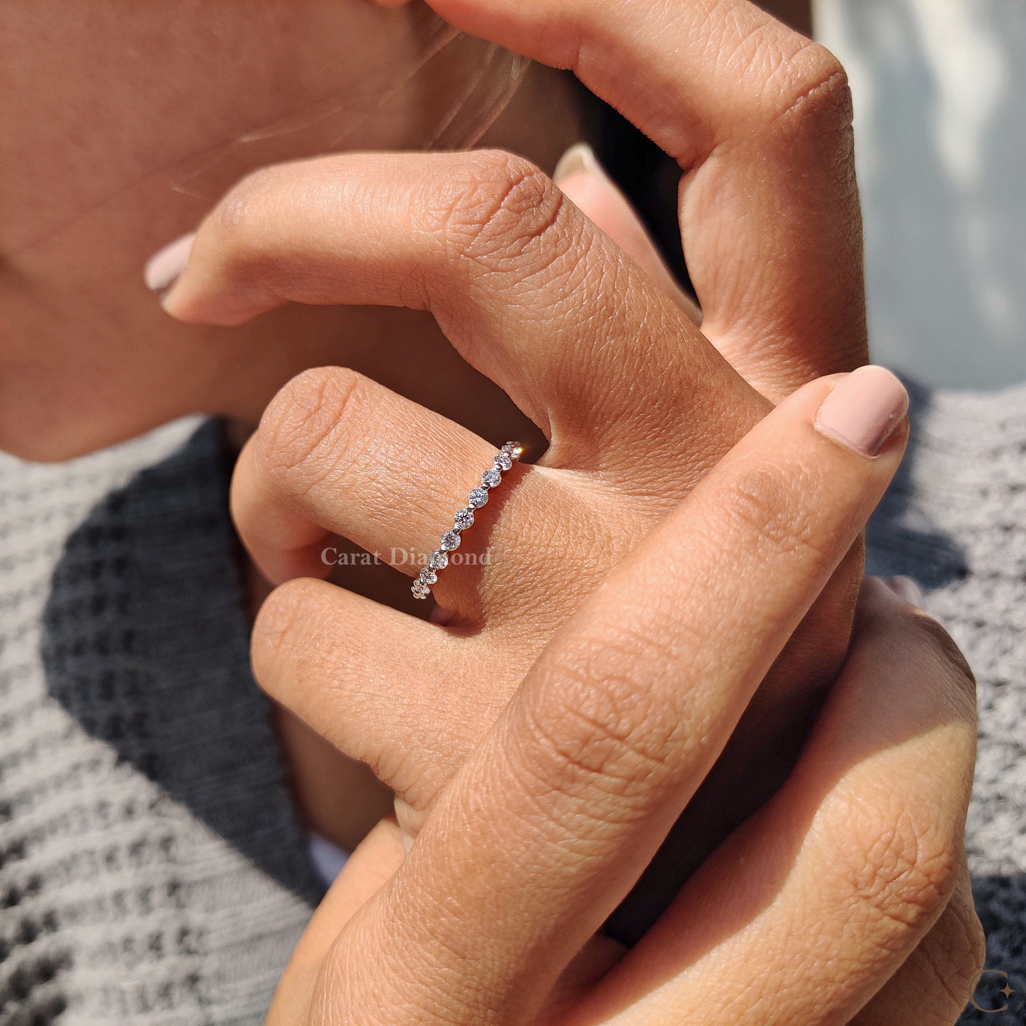 Round diamond band set in white gold for a classic look.
