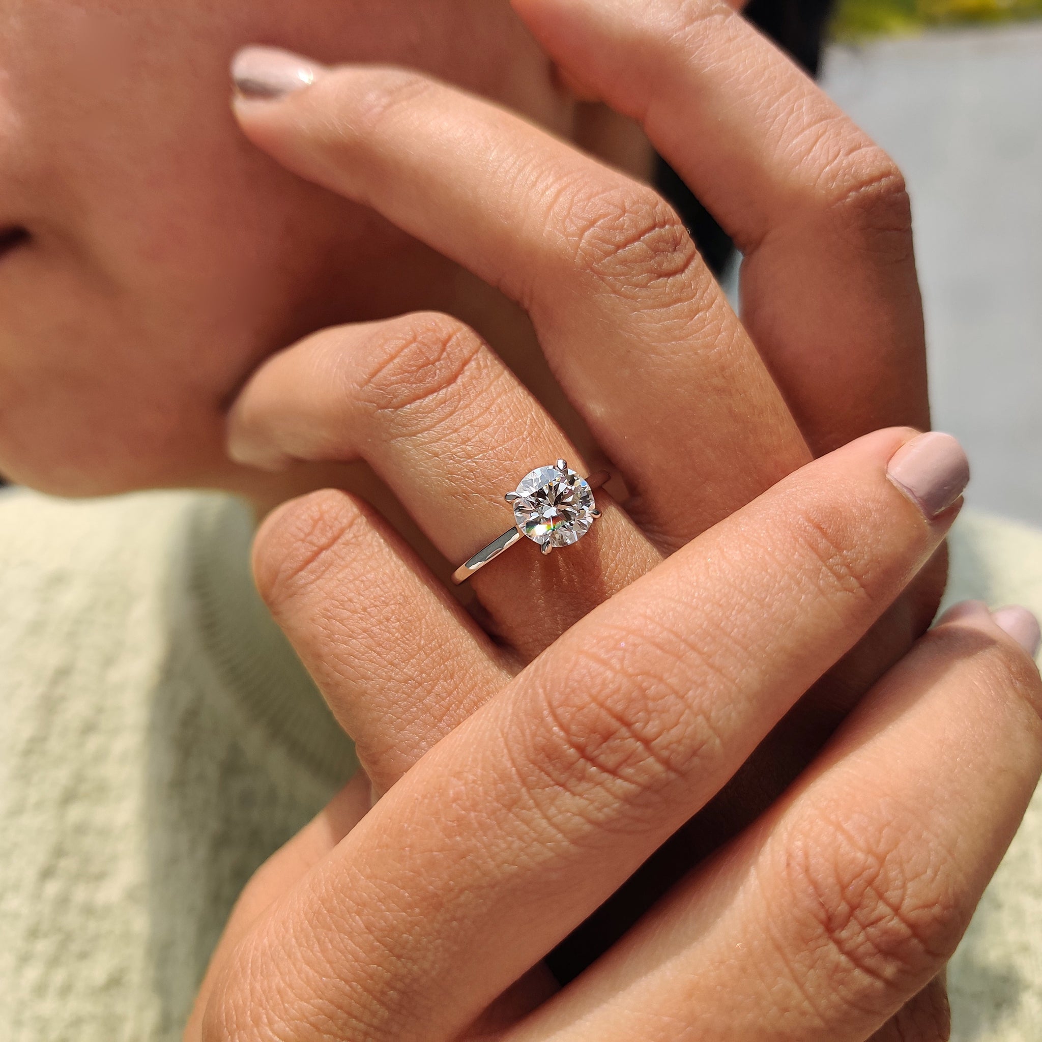 Round solitaire diamond engagement ring in white gold.

