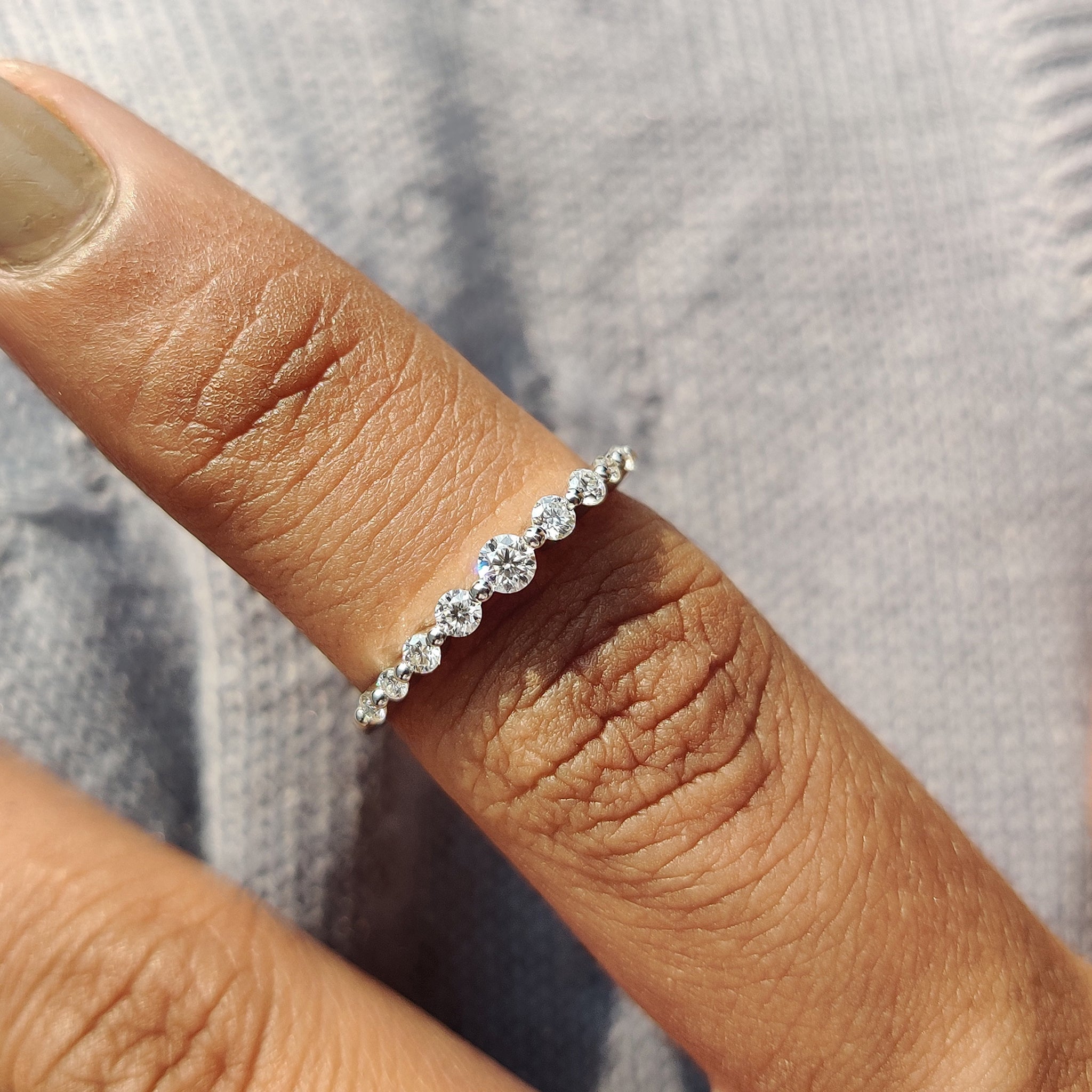 Half eternity shared prong wedding band.
