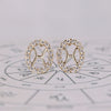 Pisces earrings in yellow gold with halo diamond studs.

