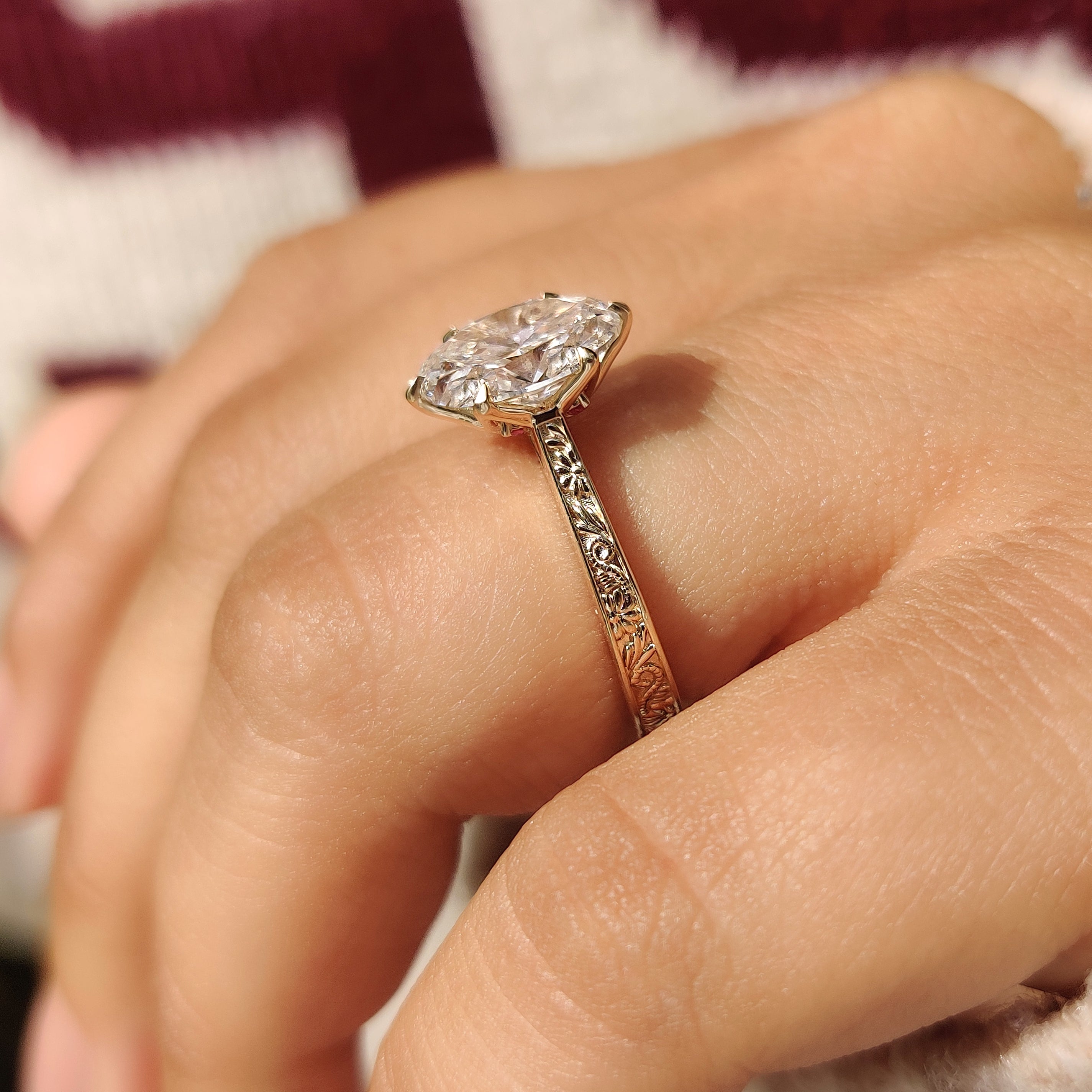 Oval lab grown diamond ring with six claw prongs
