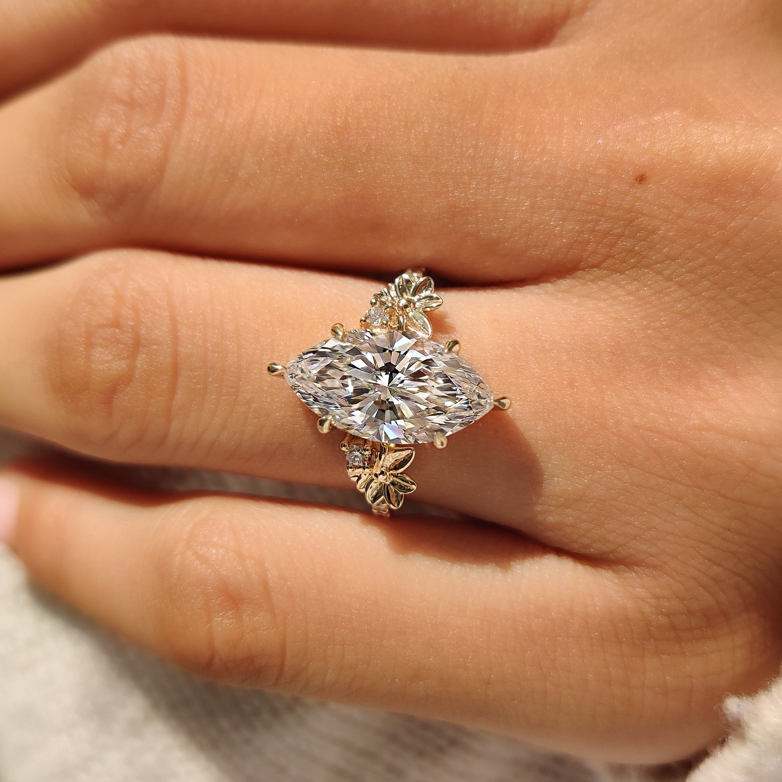 Lab grown marquise diamond ring with floral design accents

