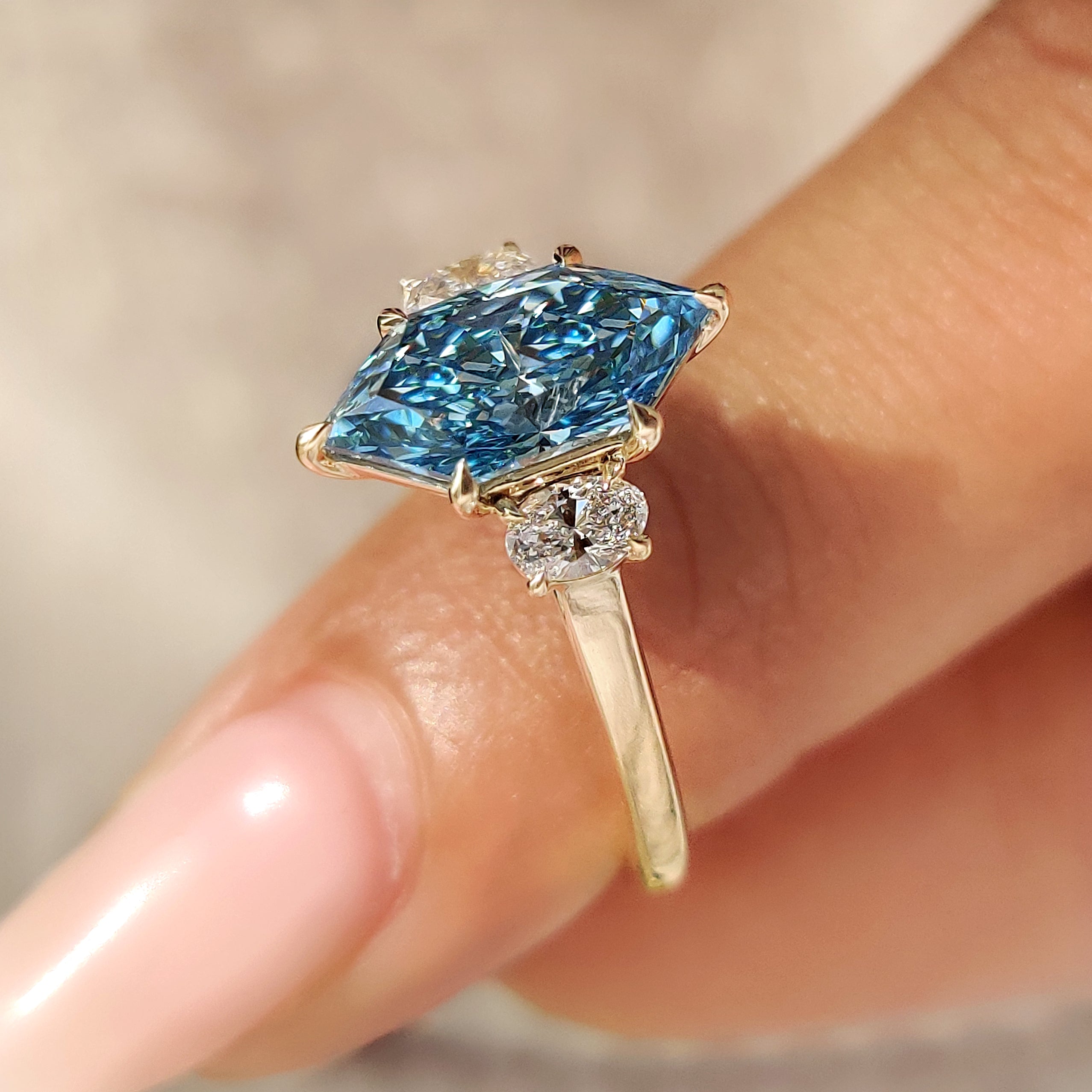 Blue Dutch marquise with six claw prong setting.
