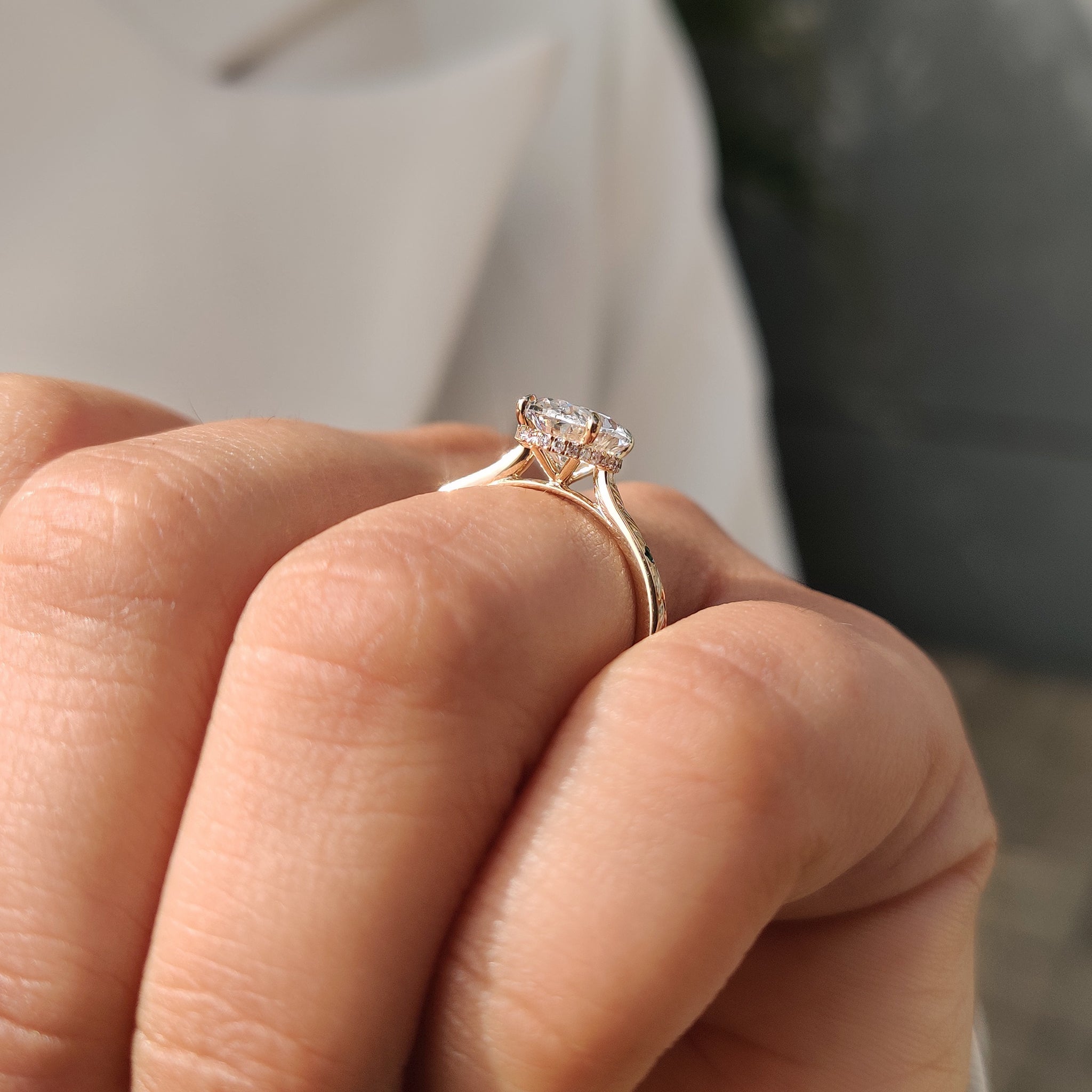 Oval cut diamond ring with refined hidden halo sparkle.
