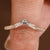 Engagement ring set with marquise diamond and curved band
