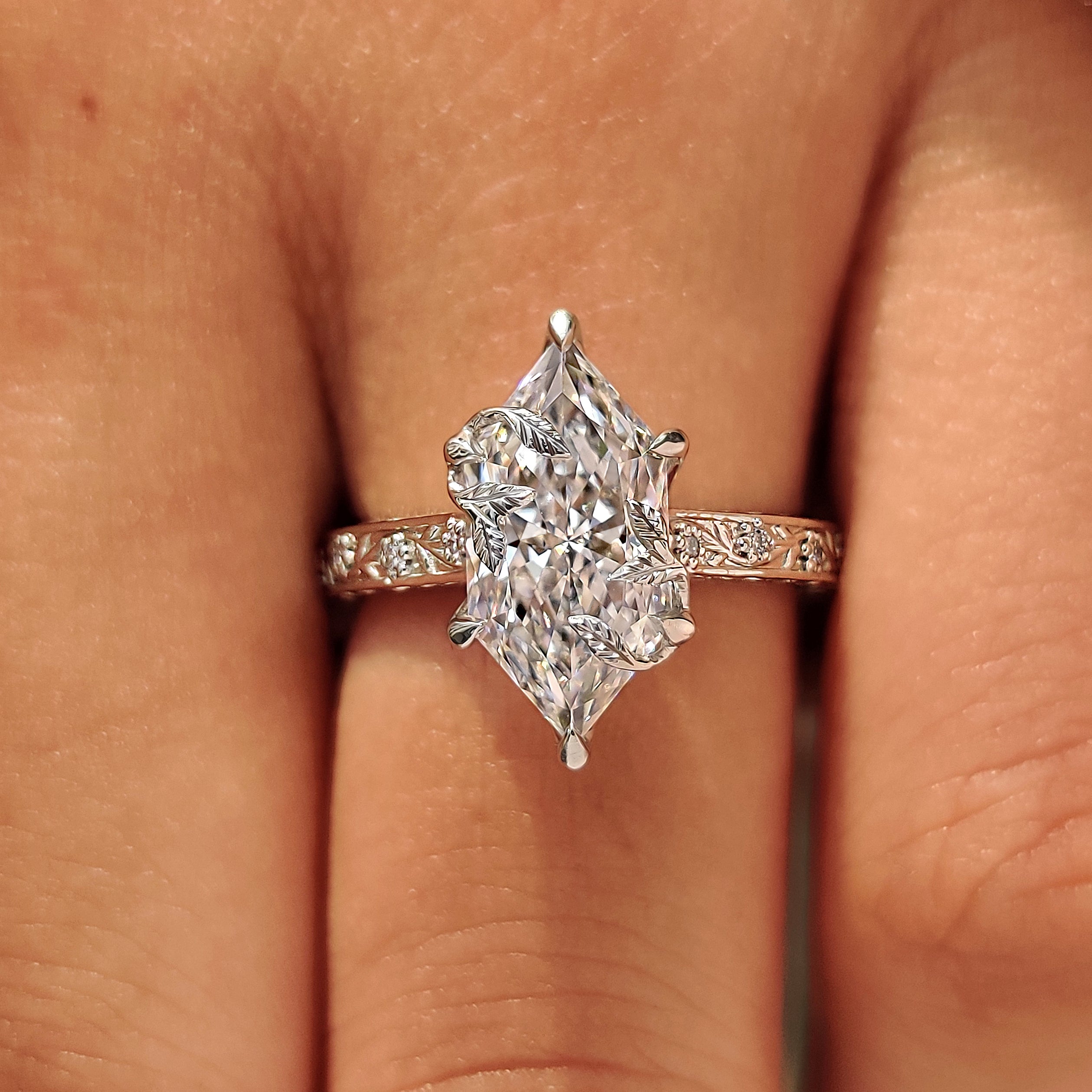 Leaf style prongs on dutch marquise diamond.
