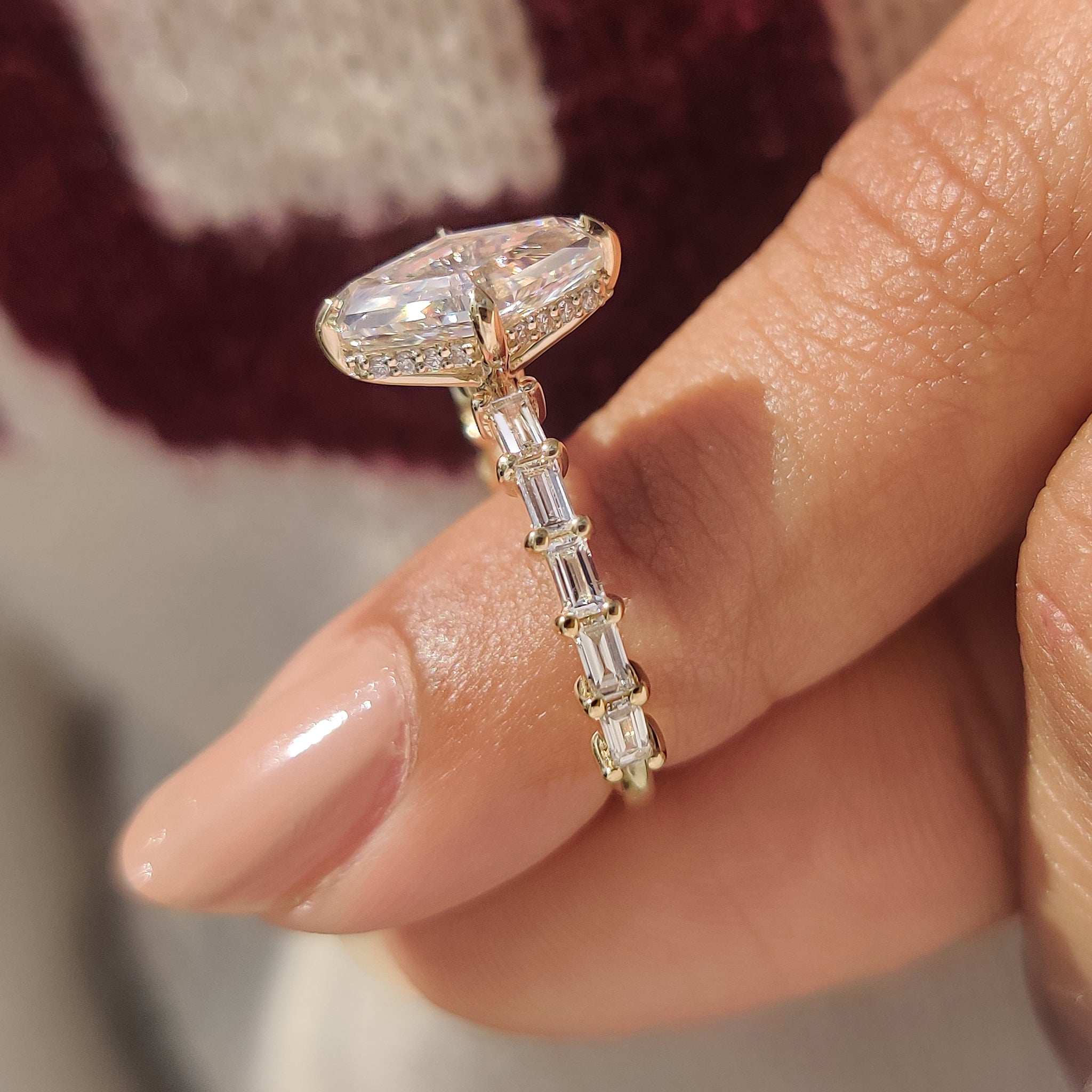 Hexagon diamond ring with baguette cut pave band style.
