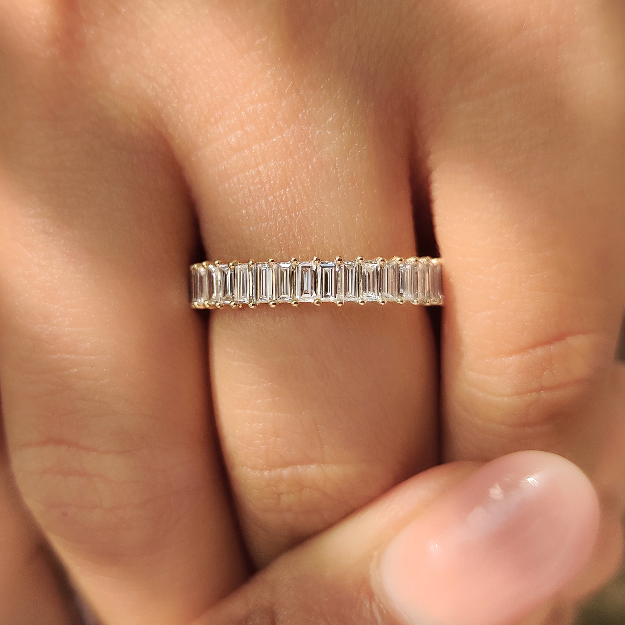 Baguette diamond wedding band with secure prong setting style.
