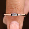 Baguette wedding band with half bezel solitaire diamond setting

