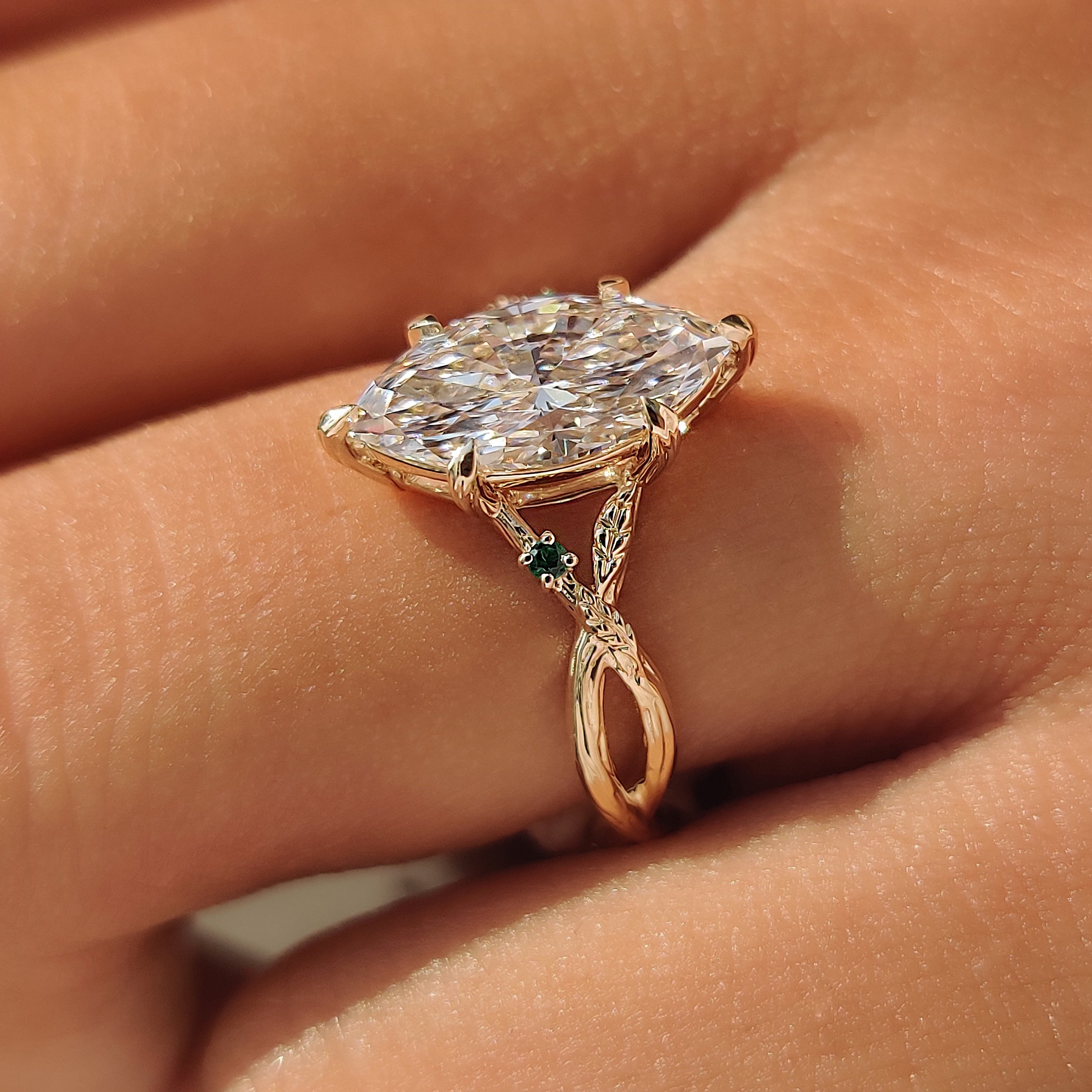 Nature inspired marquise ring with twisted branch shank.
