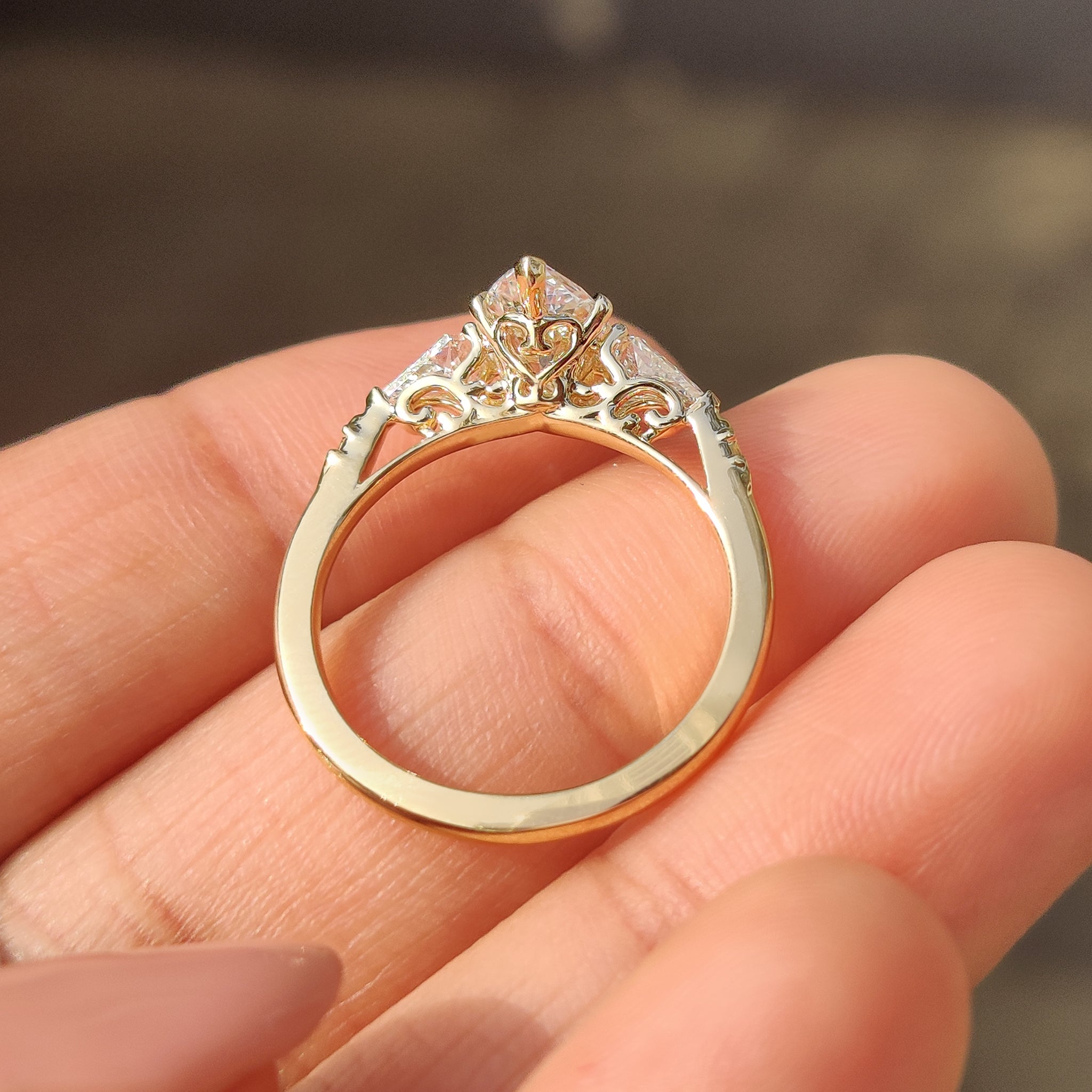 Marquise diamond ring crafted by Carat Diamonds with side stones
