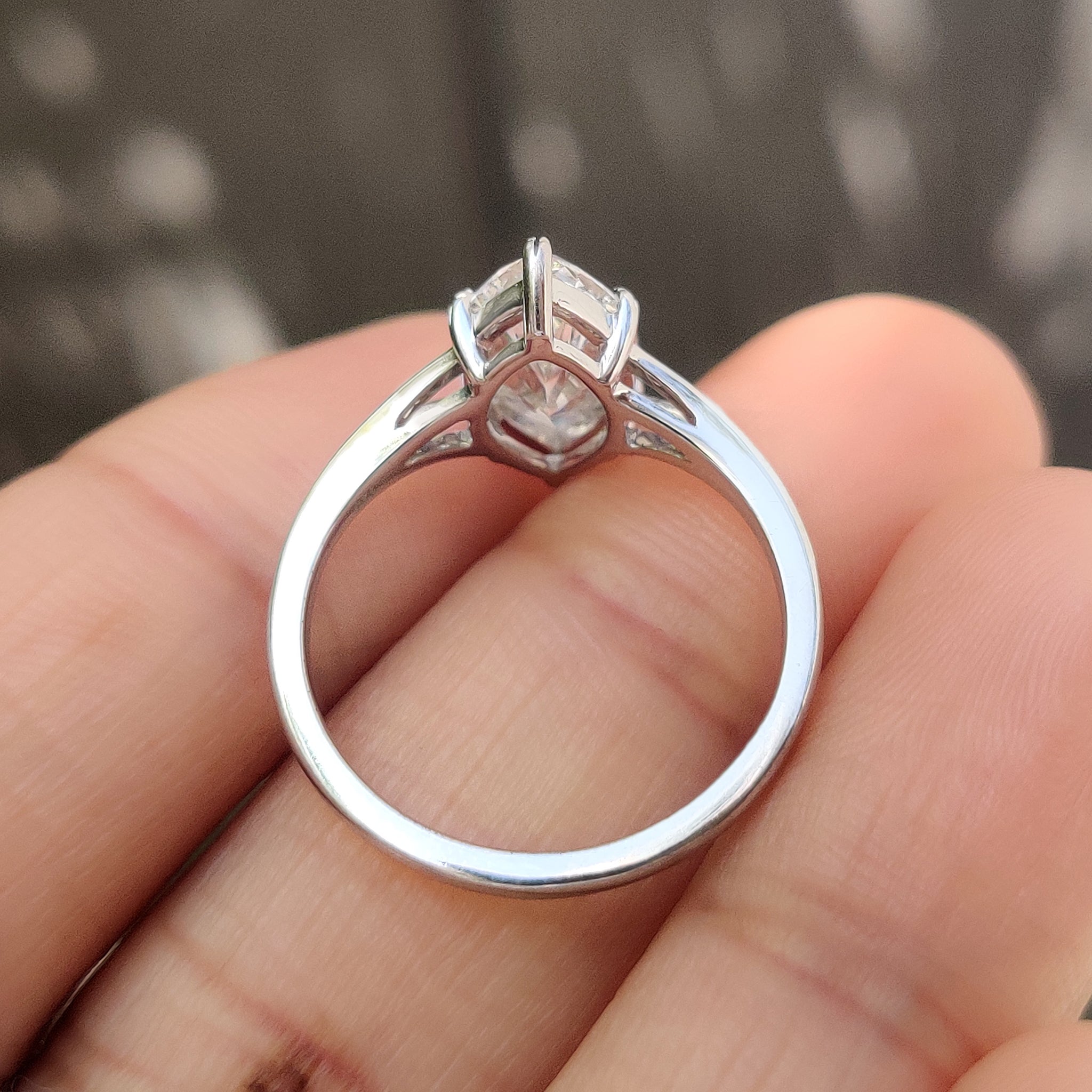 Handmade solitaire diamond ring with marquise cut and prongs.
