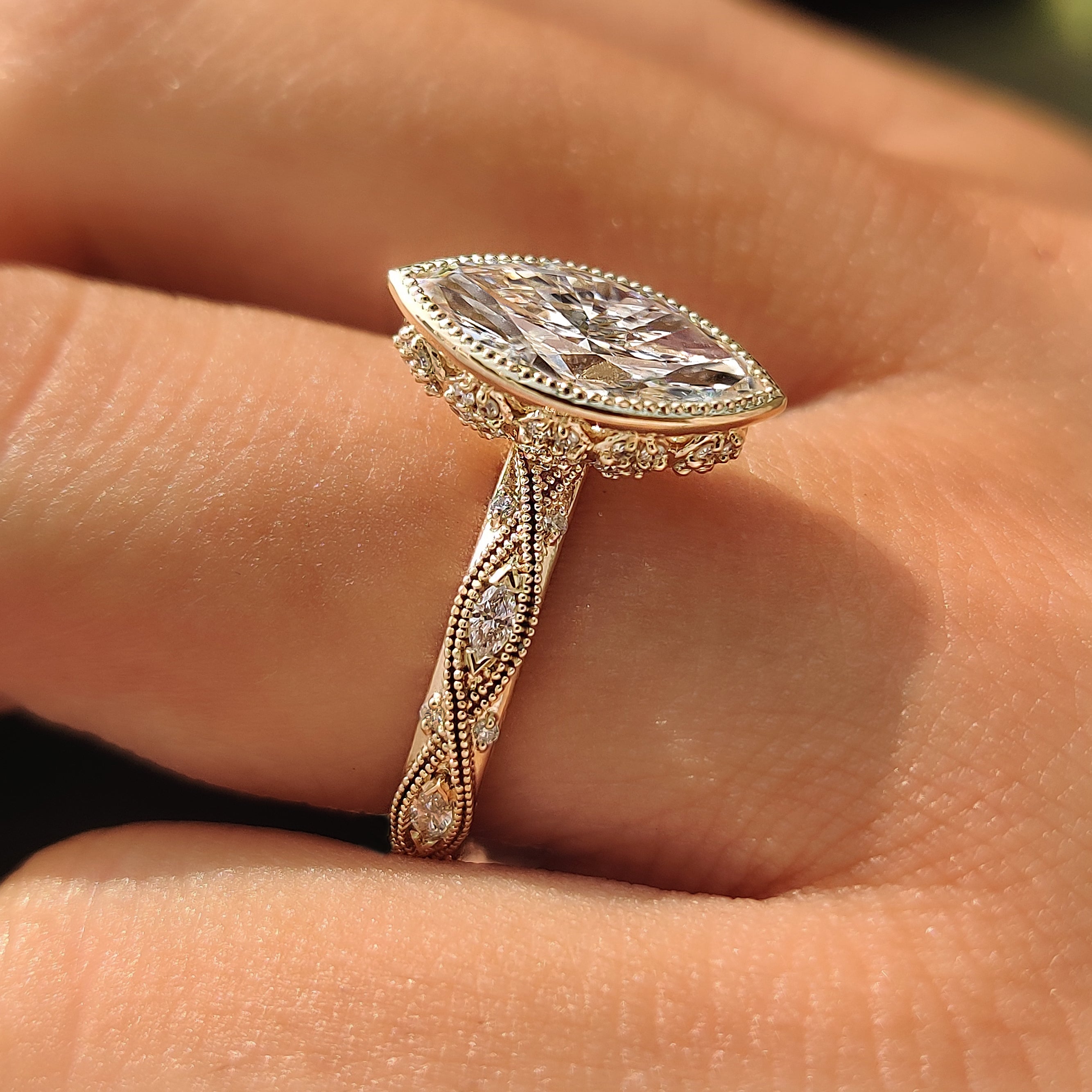 Handmade marquise diamond ring with decorative under-gallery.
