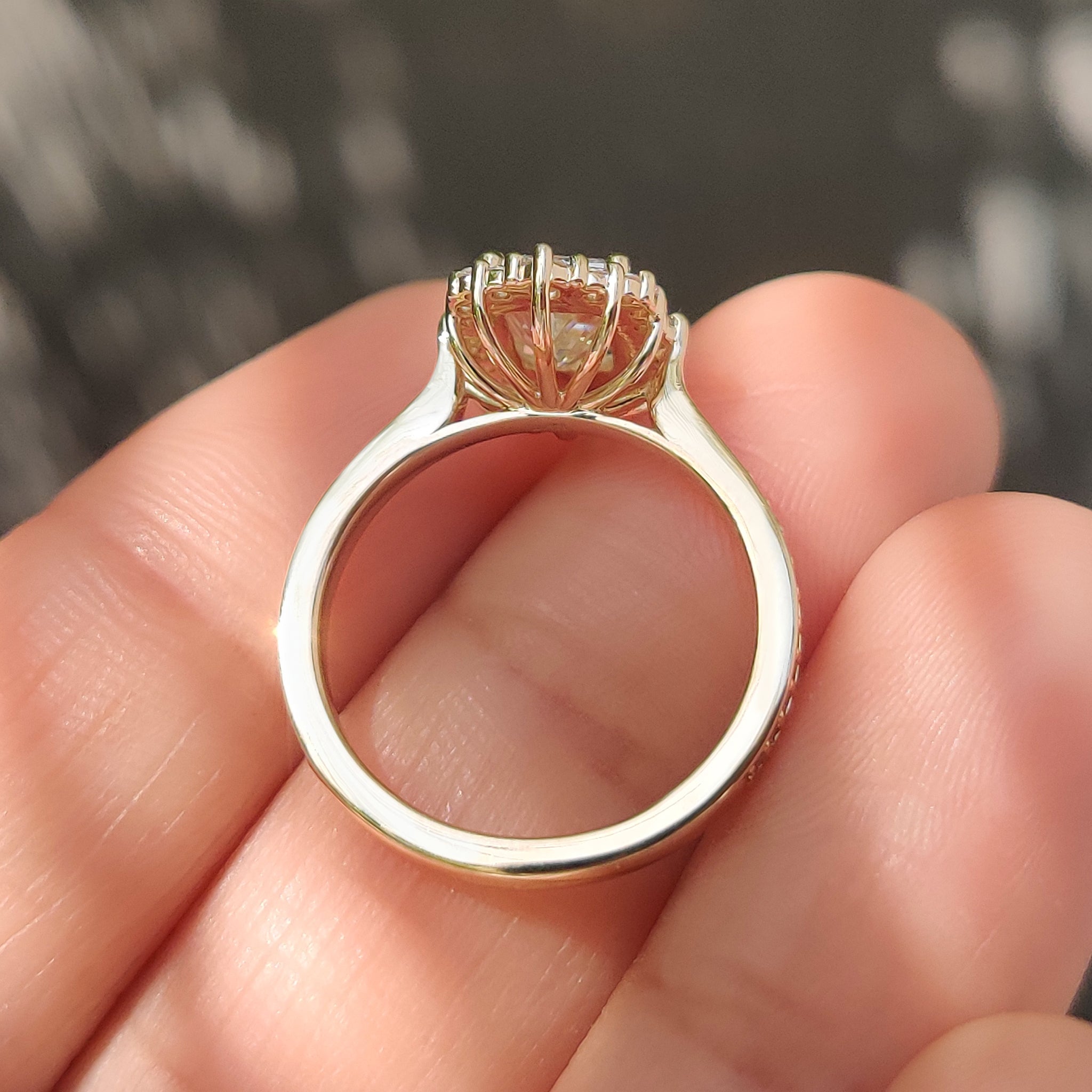 Vintage radiant cut ring with pave band and halo setting.
