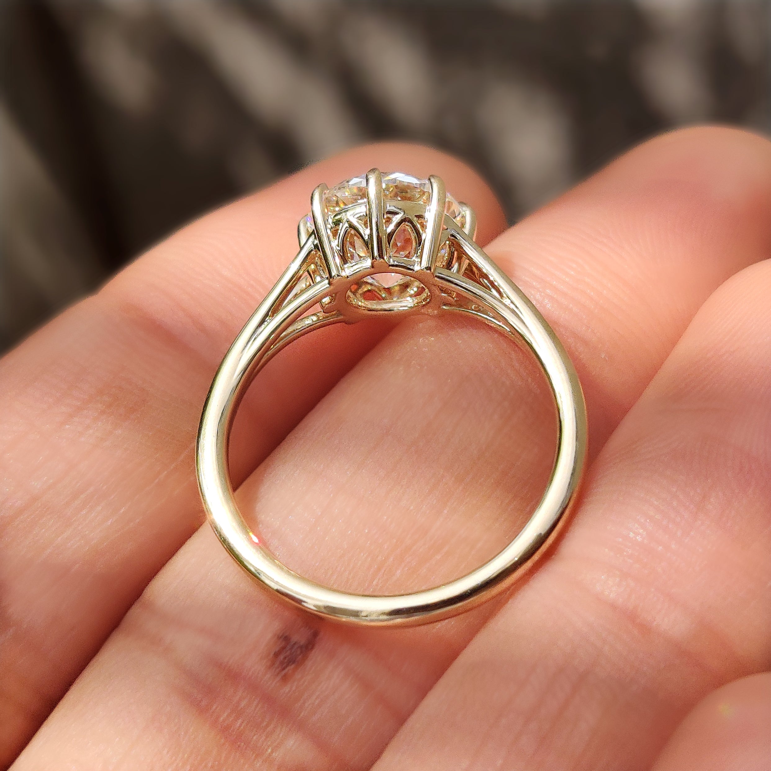 Solitaire engagement ring with eight prong setting.
