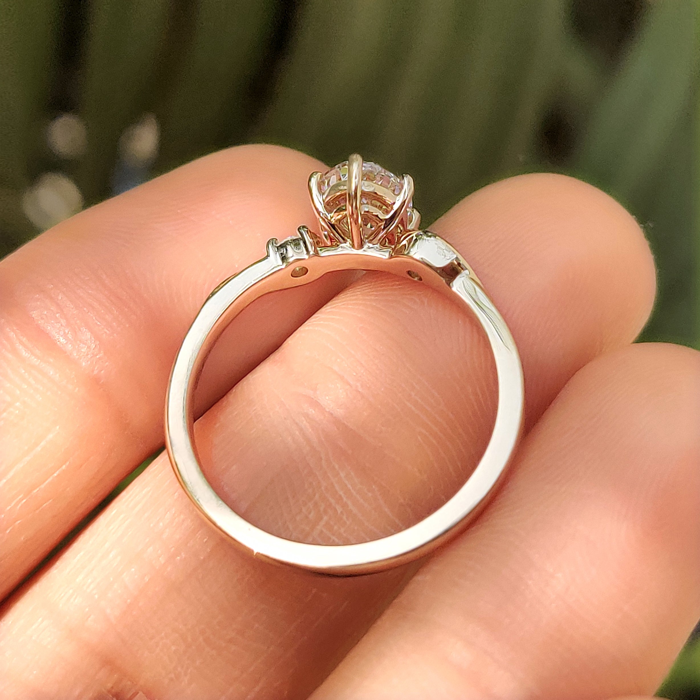 Three stone oval ring with lab grown diamond center
