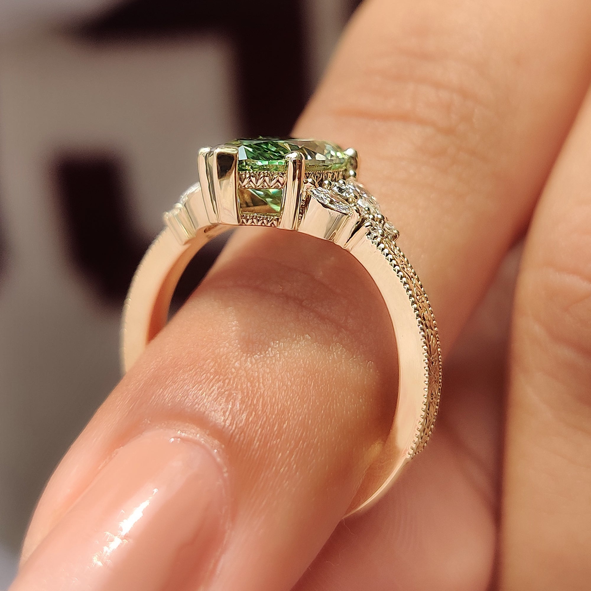 Muse setting green marquise cluster ring.
