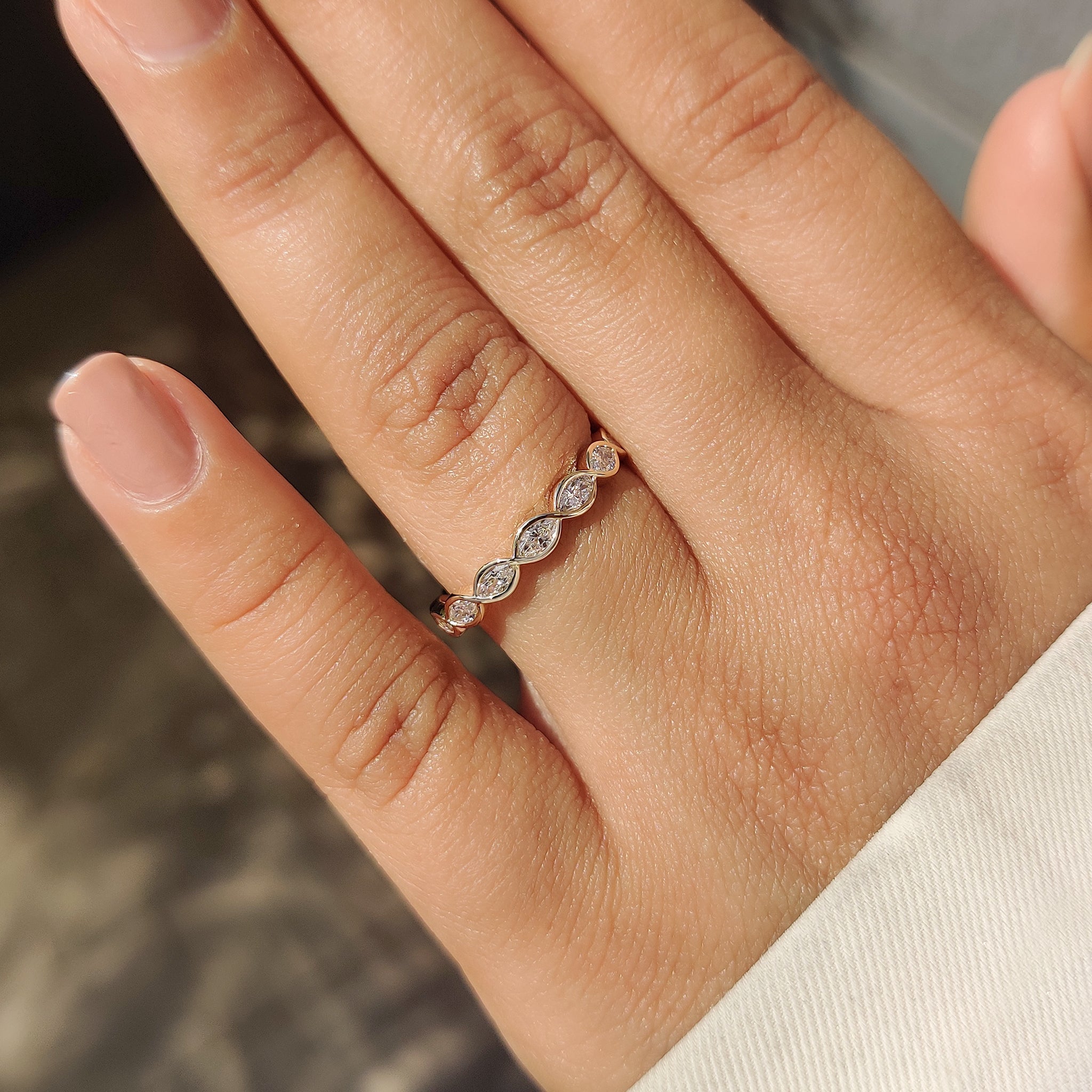 East to west marquise diamond eternity wedding band design.
