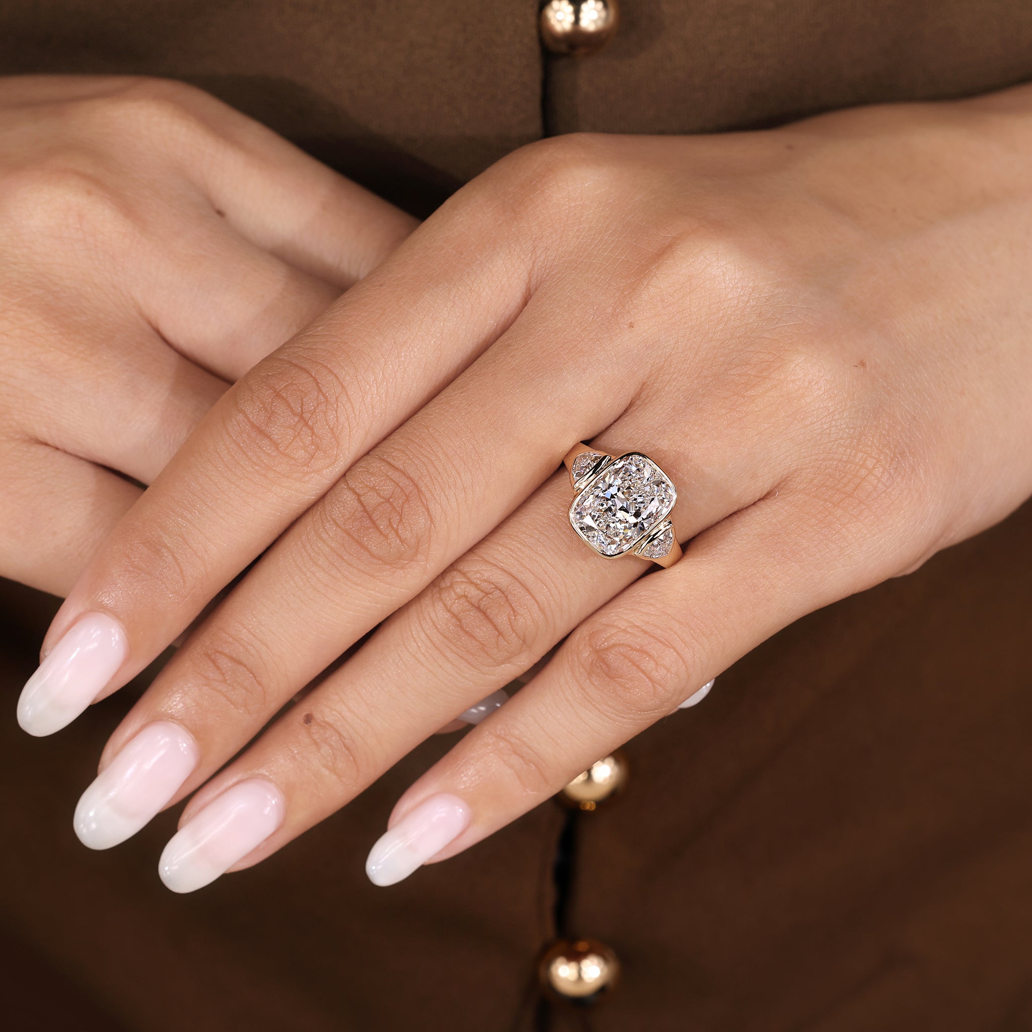 Lab grown elongated cushion cut diamond ring with trillion side stones
