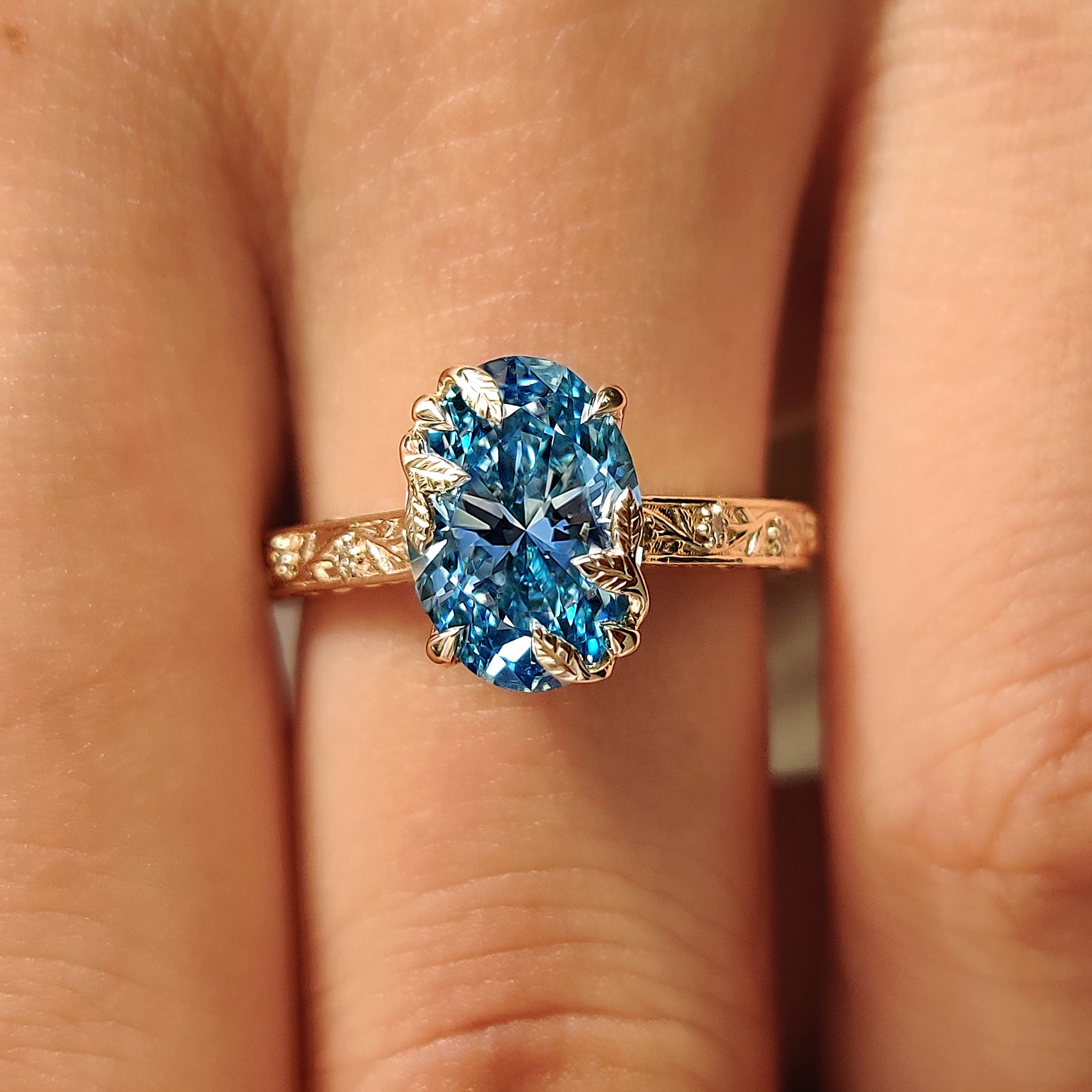 Vintage oval diamond ring with tulip setting
